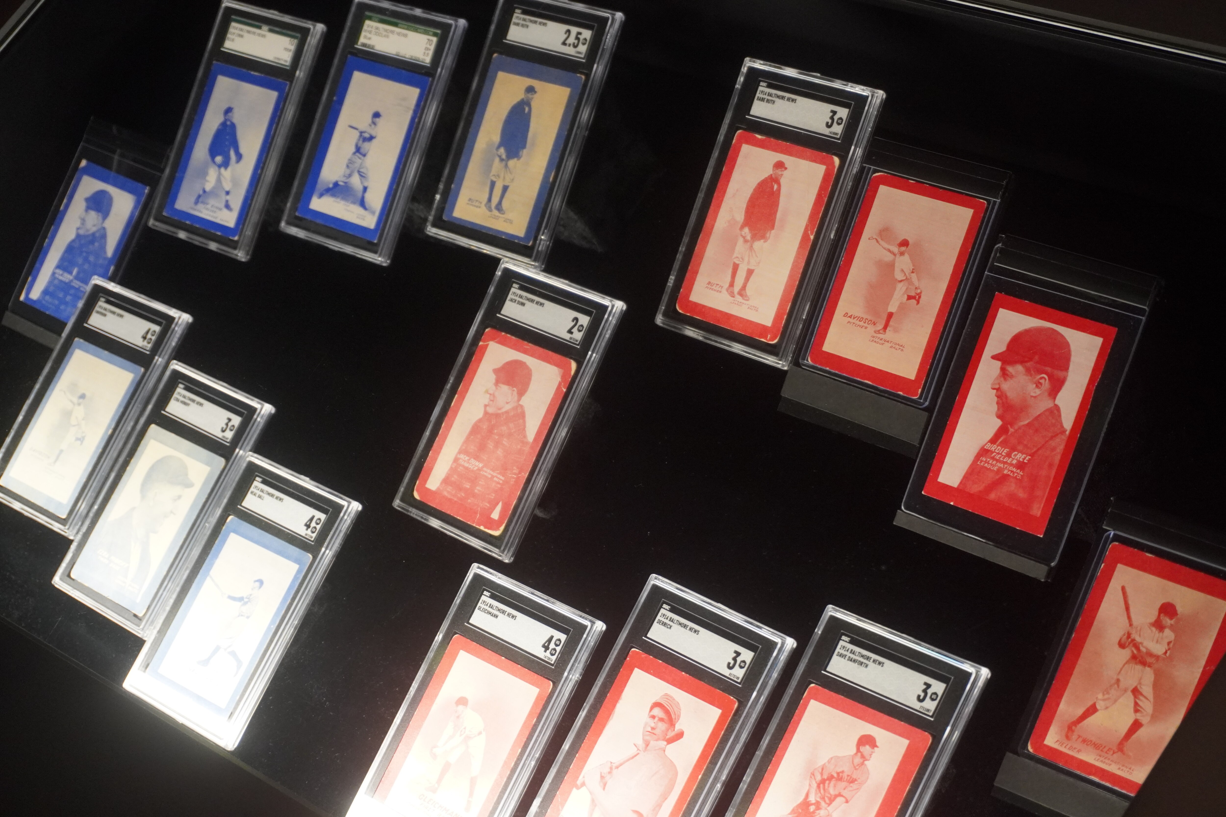 Vintage baseball cards are on display inside the Babe Ruth Birthplace and Museum, including one of only 10 known copies of an early Babe Ruth card (top of display).