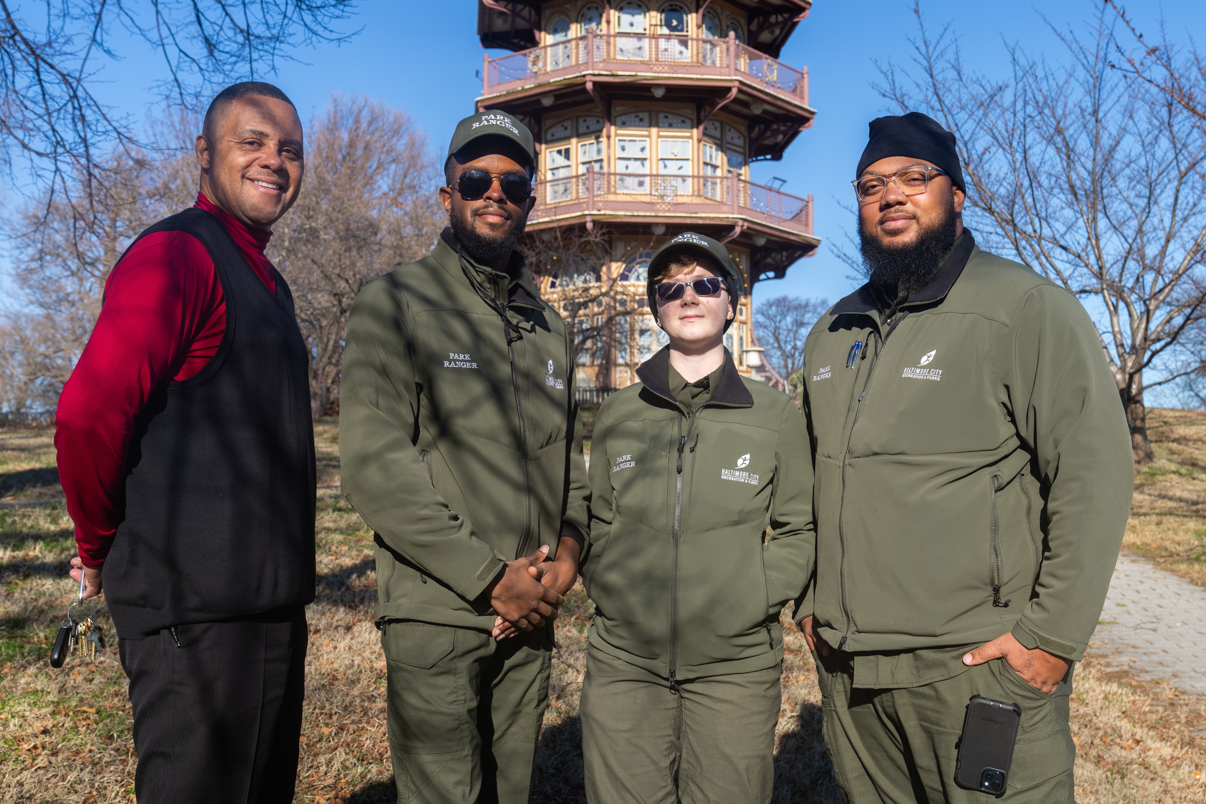 Chief of Safety Security Risk and Fleet Management for Baltimore City Recreation and Parks Dorsey Skinner and park rangers Tavon Powell, Willow Overly and Donte Futrell pose for a photo in Patterson Park on Thursday, Jan. 11, 2024.