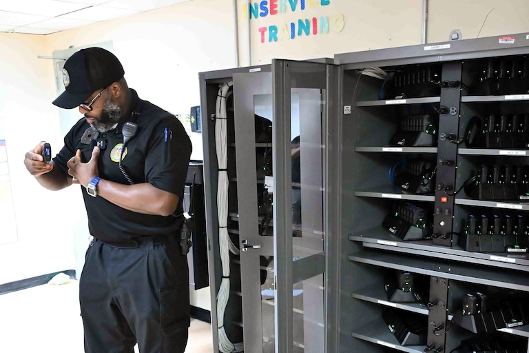 Sgt. Shawn Elliott of Baltimore’s Central Booking & Intake Center clips a body camera to his uniform. The Maryland Department of Public Safety and Correctional Services recently rolled out body cameras to all guards across the state’s prisons.