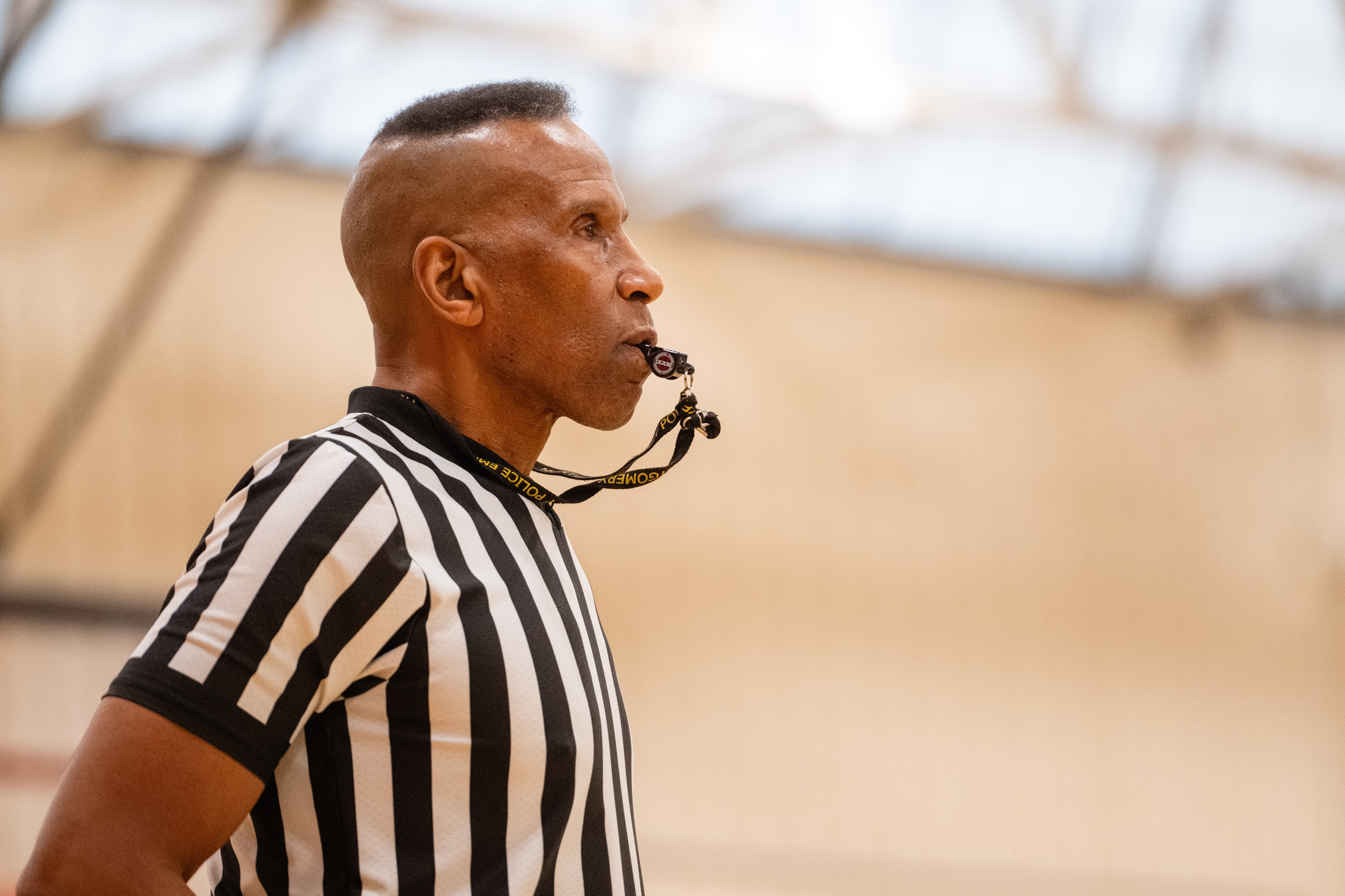 Adrian Dantley, an NBA Hall of Famer and two-time scoring champion, referees a recreational basketball league game at the Upper County Community Center in Gaithersburg.