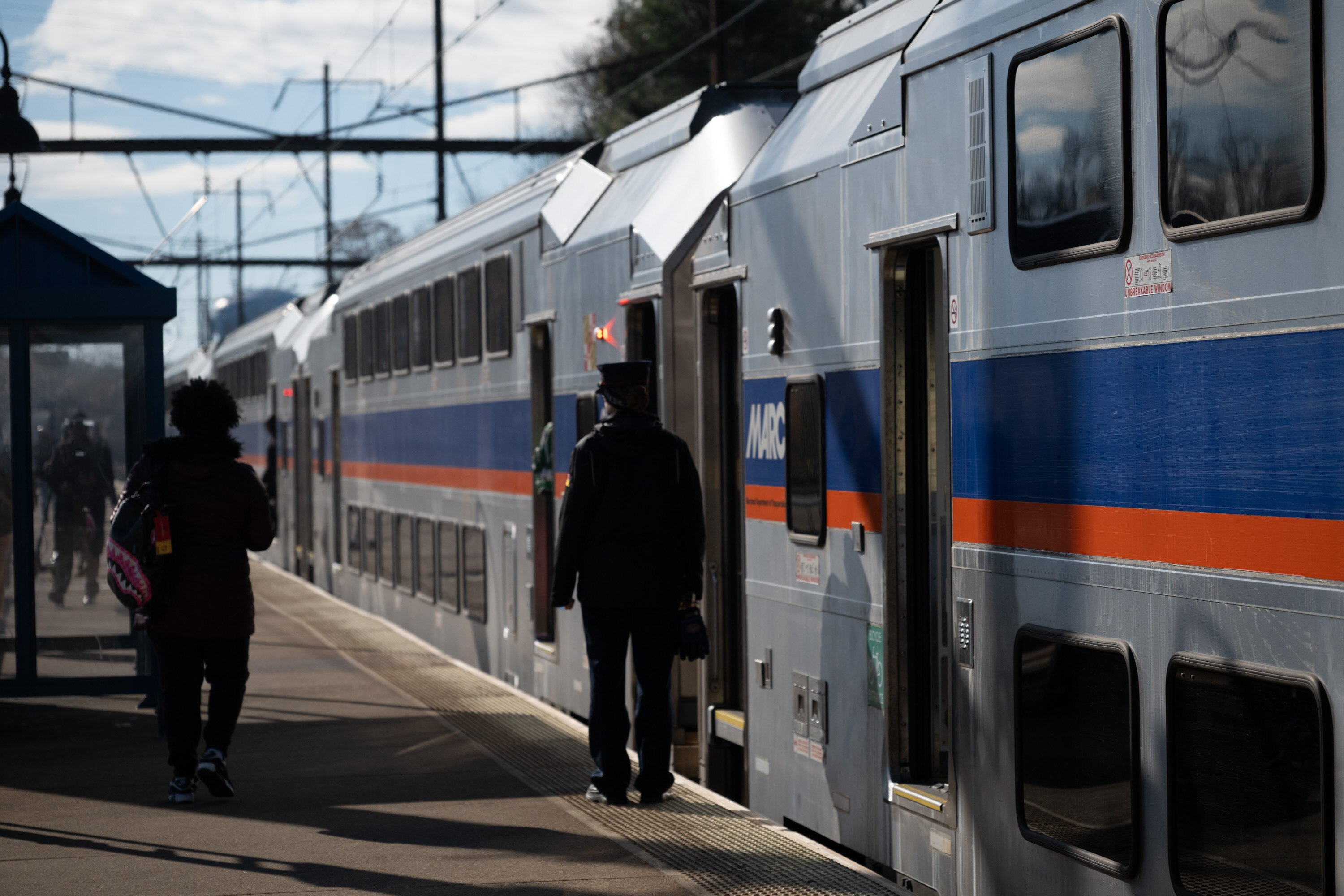 A passenger waits to board a northbound MARC train at the Odenton station.