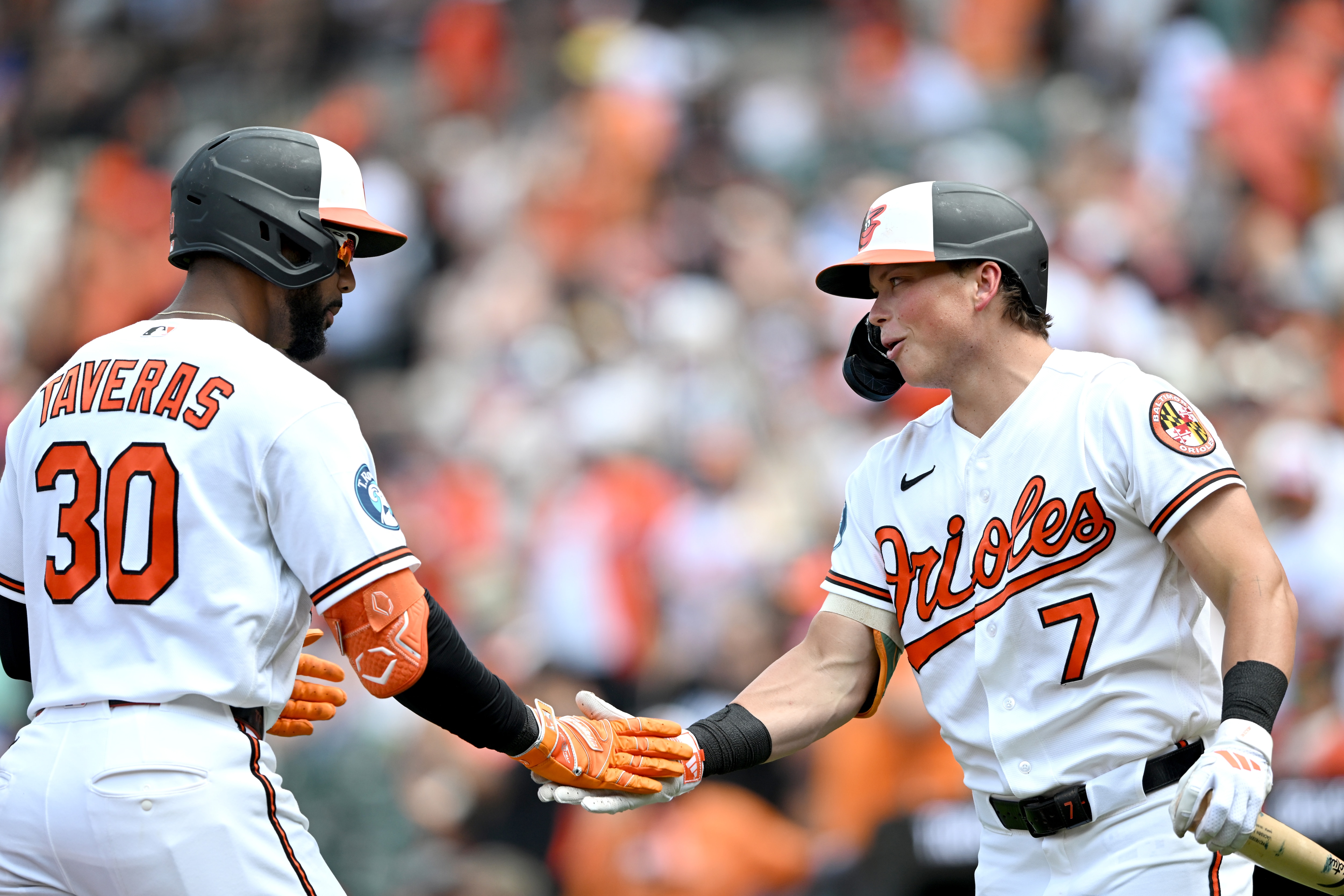 Leody Taveras is greeted by Jackson Holliday after hitting a two-run home run in the second inning Sunday at Camden Yards.