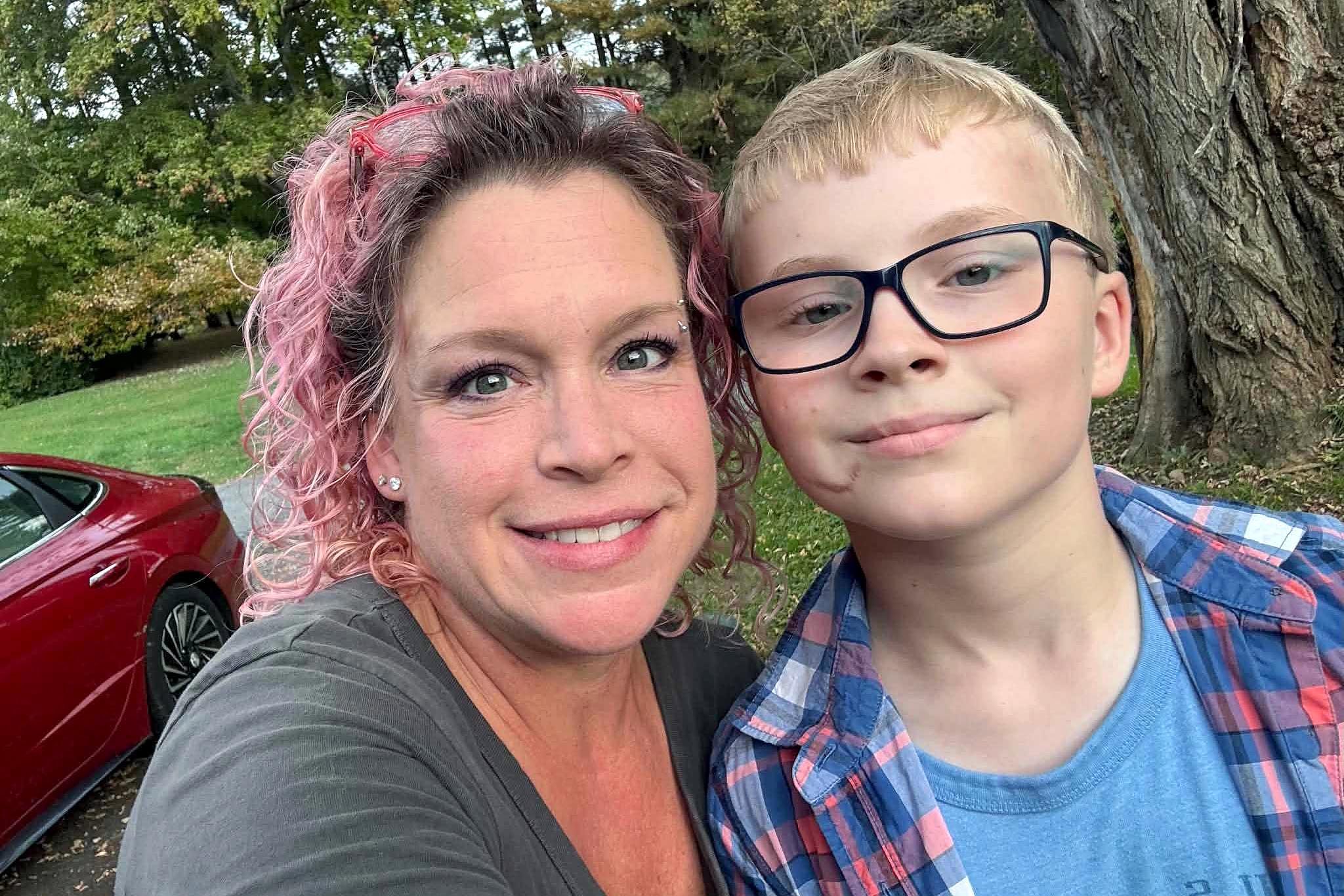 Taffy Thomas, left, with her son, Alex Thomas, who rescued a kitten in the road.