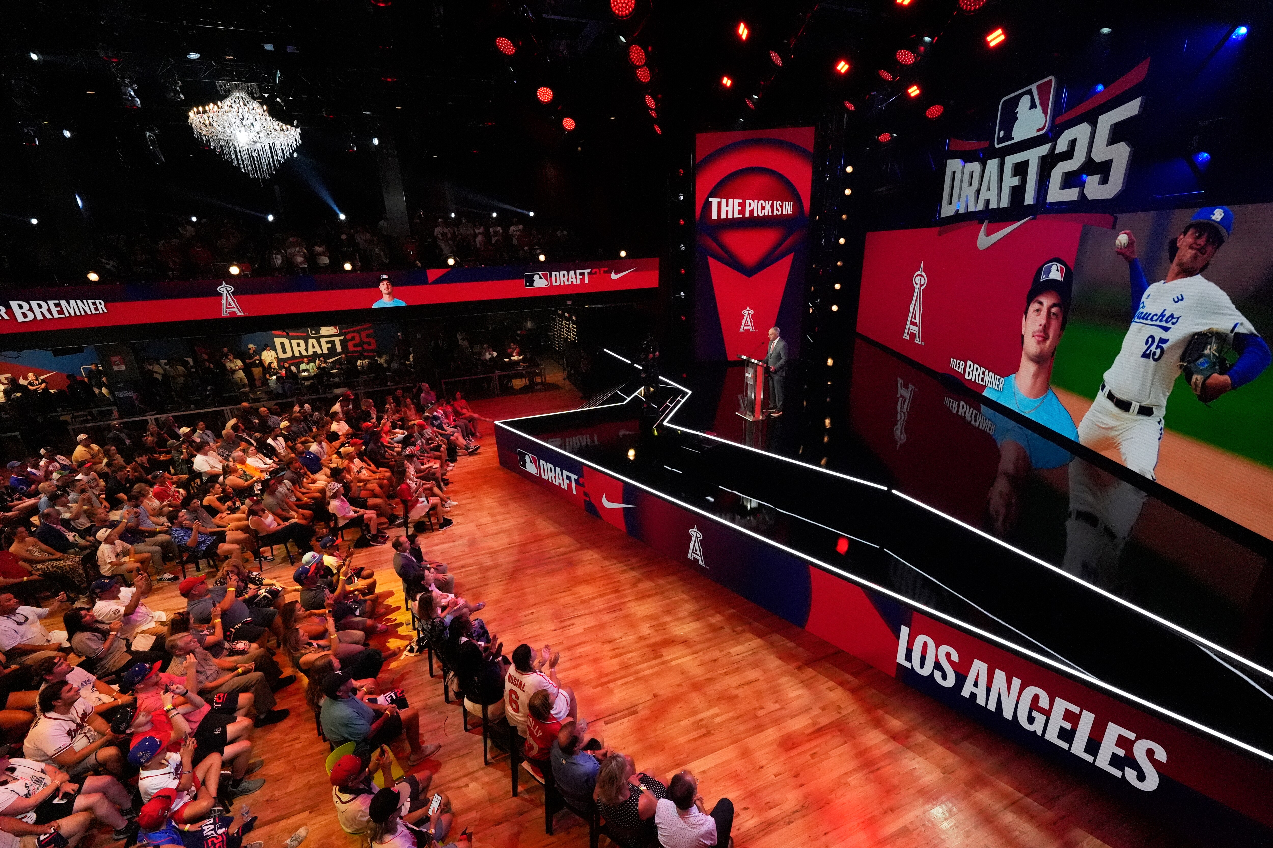 Fans gather to watch the first round of the MLB baseball draft Sunday, July, 13, 2025 in Atlanta.