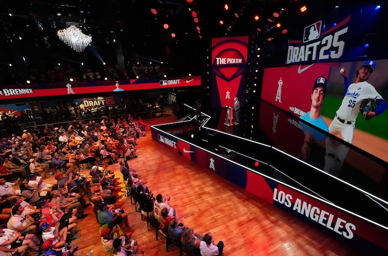 Fans gather to watch the first round of the MLB baseball draft Sunday, July, 13, 2025 in Atlanta.