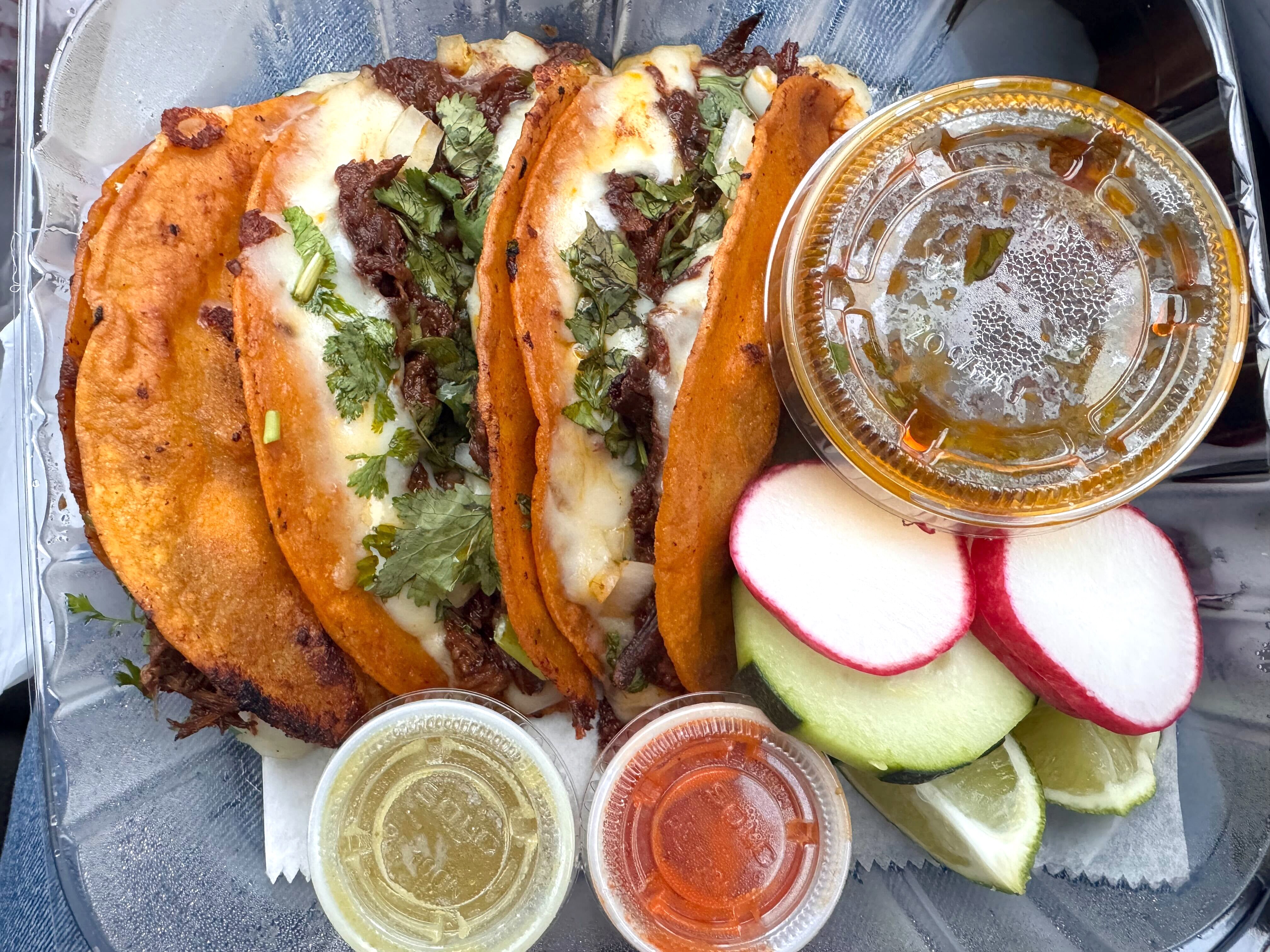 Birria tacos at Tacos El Guero Food Truck off Merritt Boulevard come with herbs worth savoring.