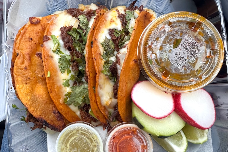 Birria tacos at Tacos El Guero Food Truck off Merritt Boulevard come with herbs worth savoring.
