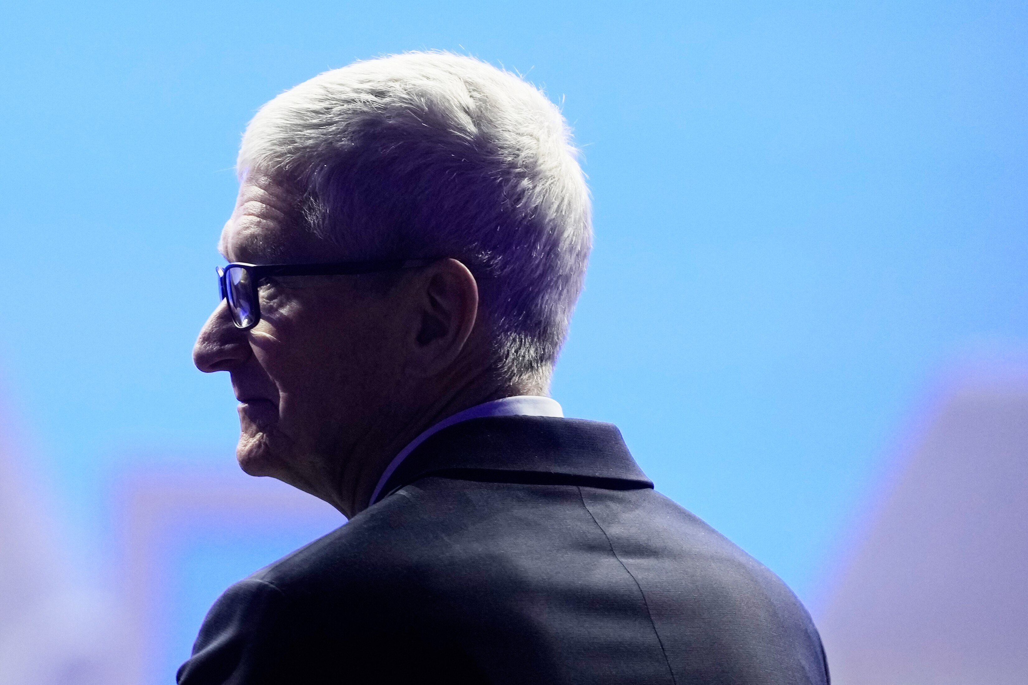 Apple CEO Tim Cook waits for the arrival of President Donald Trump during the Annual Meeting of the World Economic Forum in Davos, Switzerland, Wednesday, Jan. 21, 2026.