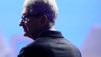 Apple CEO Tim Cook waits for the arrival of President Donald Trump during the Annual Meeting of the World Economic Forum in Davos, Switzerland, Wednesday, Jan. 21, 2026.
