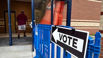 People head into vote in the primary election at Reservoir High School in Fulton as polls open on Tuesday morning.