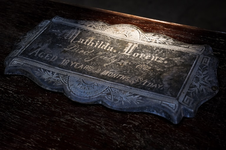 The nameplate on the outside of Mathilda Lorenz’s empty casket on July 28, 2022. The mysterious casket was originally found down by a stream in Wyman Park.