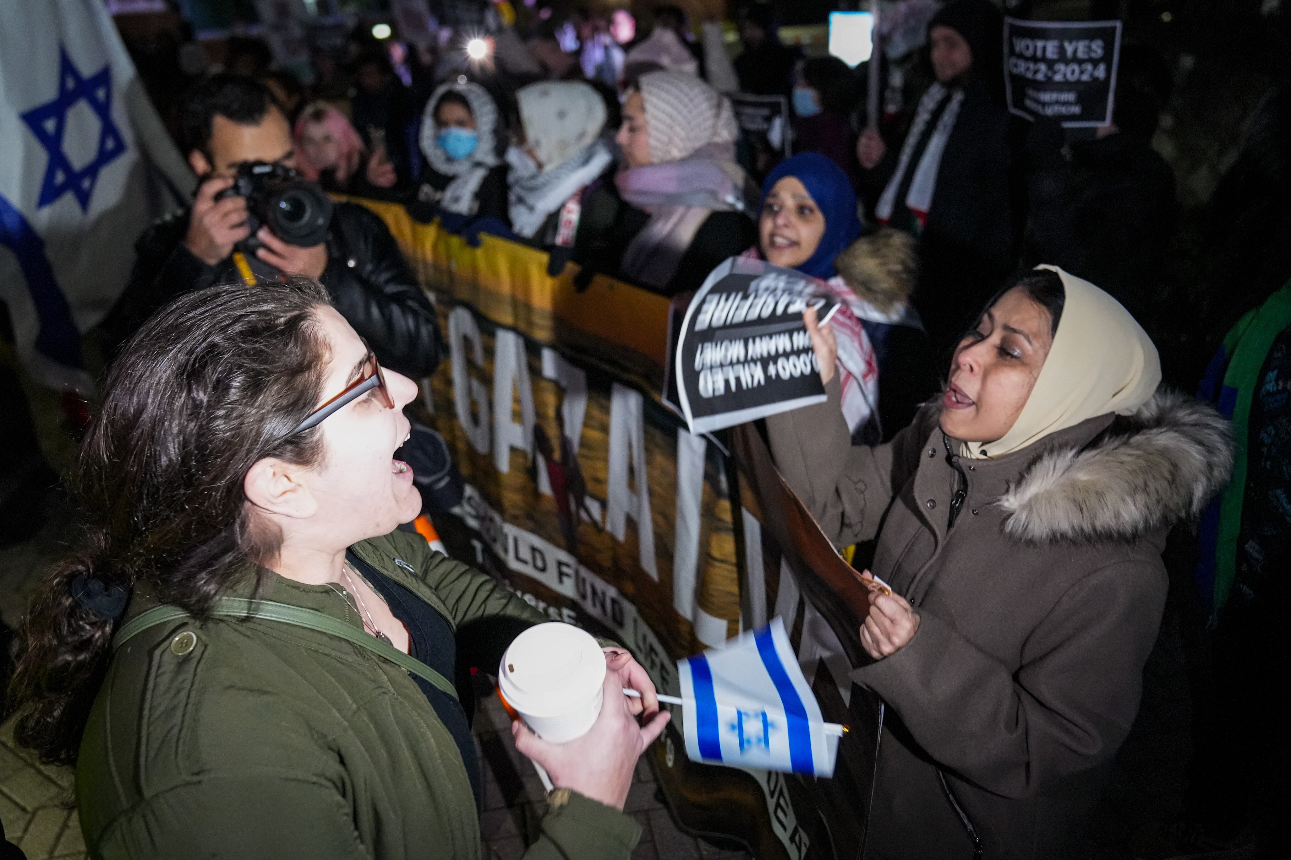 Pro-Israel and pro-Palestine demonstrators shout at each other outside the George Howard government building in Ellicott City on Feb. 5.