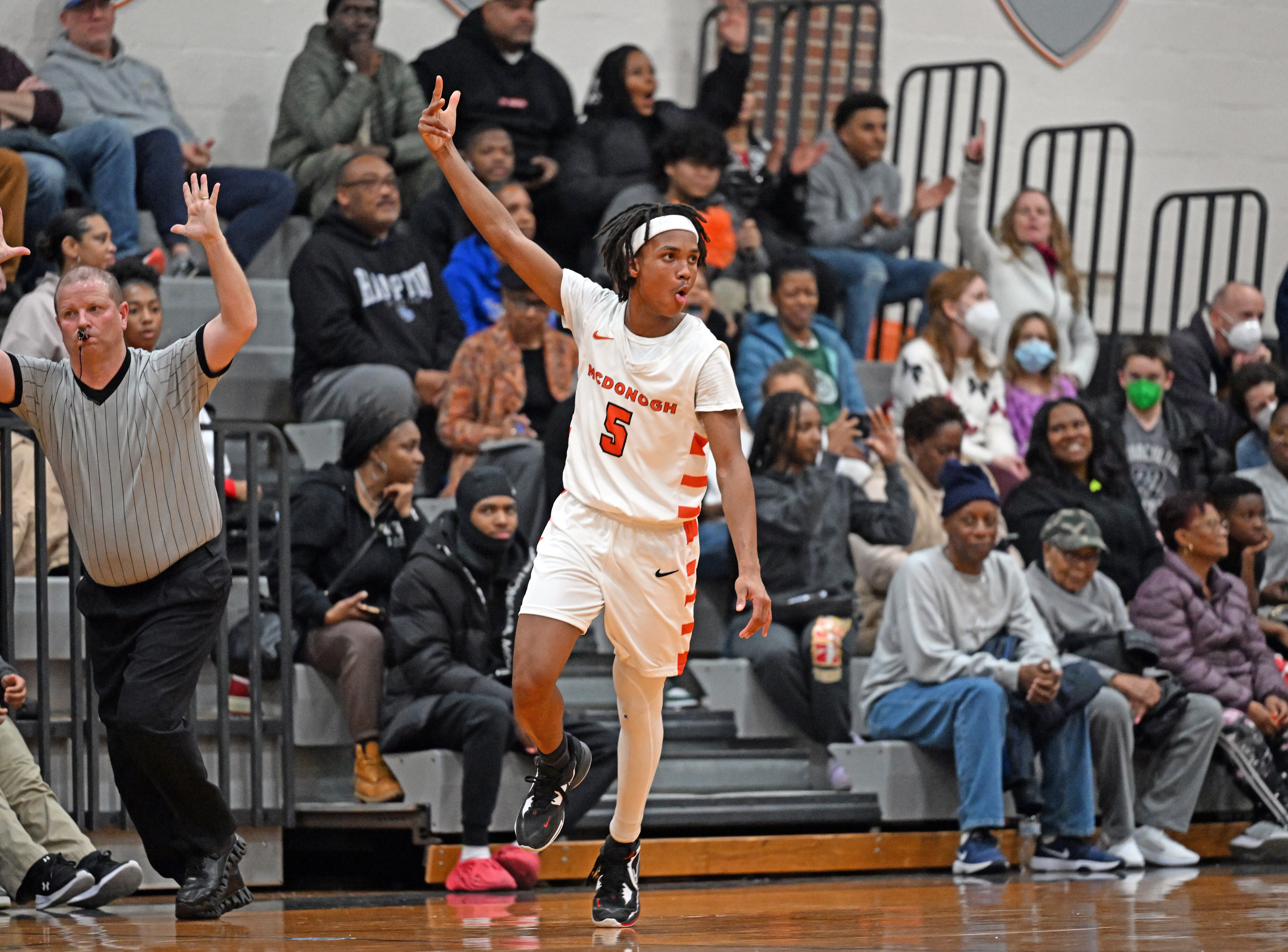McDonogh's Ashton Kendall celebrates a 3-pointer during the first half of Friday's MIAA A Conference basketball match with Loyola. The junior had five on the evening, the final from the corner with six seconds left in regulation, lifting the No. 9 Eagles to a 67-65 victory over the sixth-ranked Dons in Owings Mills.