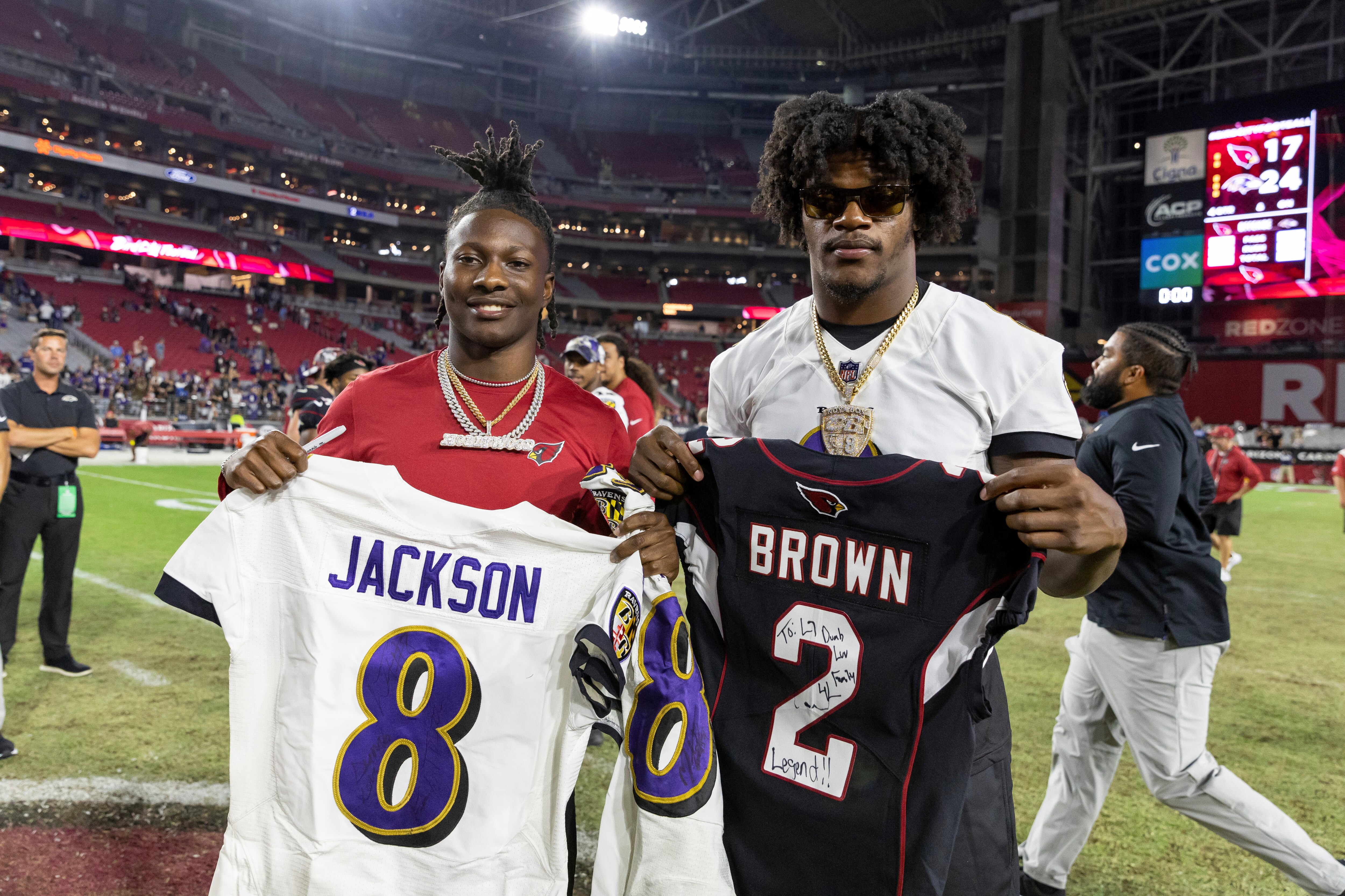 Lamar Jackson does a jersey swap and poses with Marquise “Hollywood” Brown in 2022.