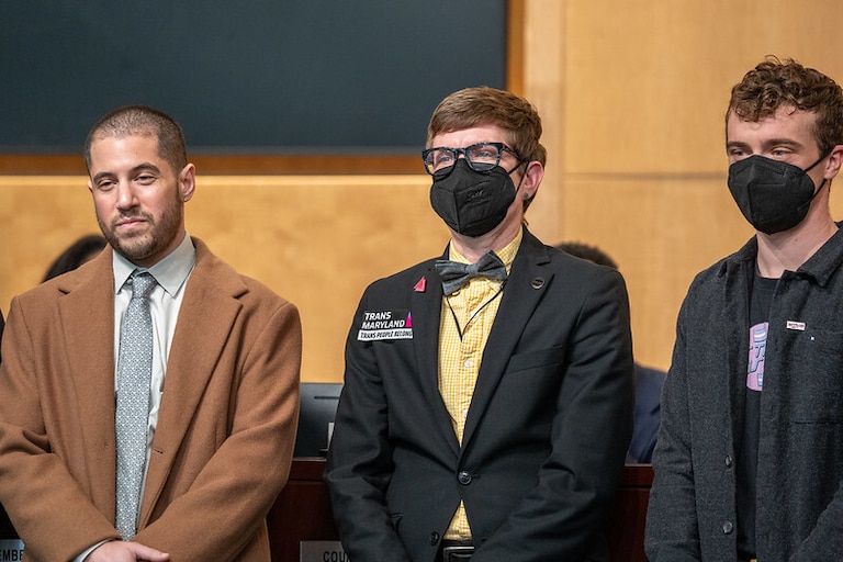 Shane Heneise, left, at a Trans Day of Visibility Proclamation led by Montgomery County Council member Kate Stewart on March 24. To his right is Lee Blinder, the director of Trans Maryland.