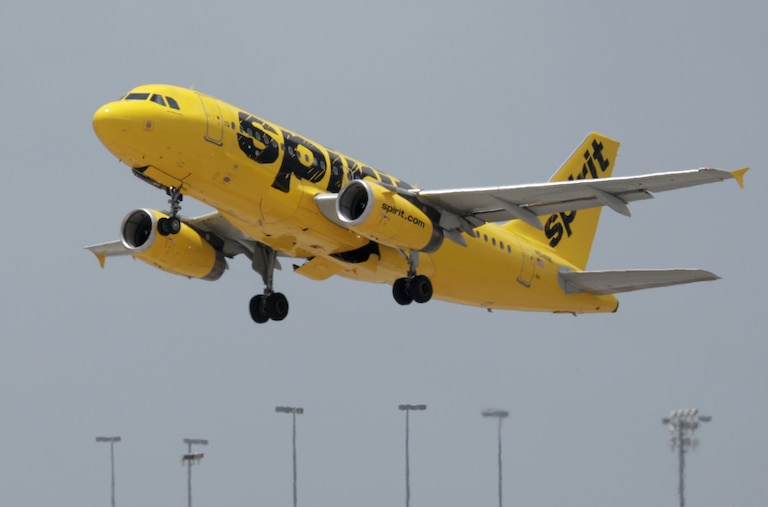 A Spirit airlines plane takes off from Miami International Airport on July 27, 2022 in Miami, Florida. Spirit Airlines Inc. shareholders are voting whether to merge with Frontier Airlines or JetBlue Airways Corp.
