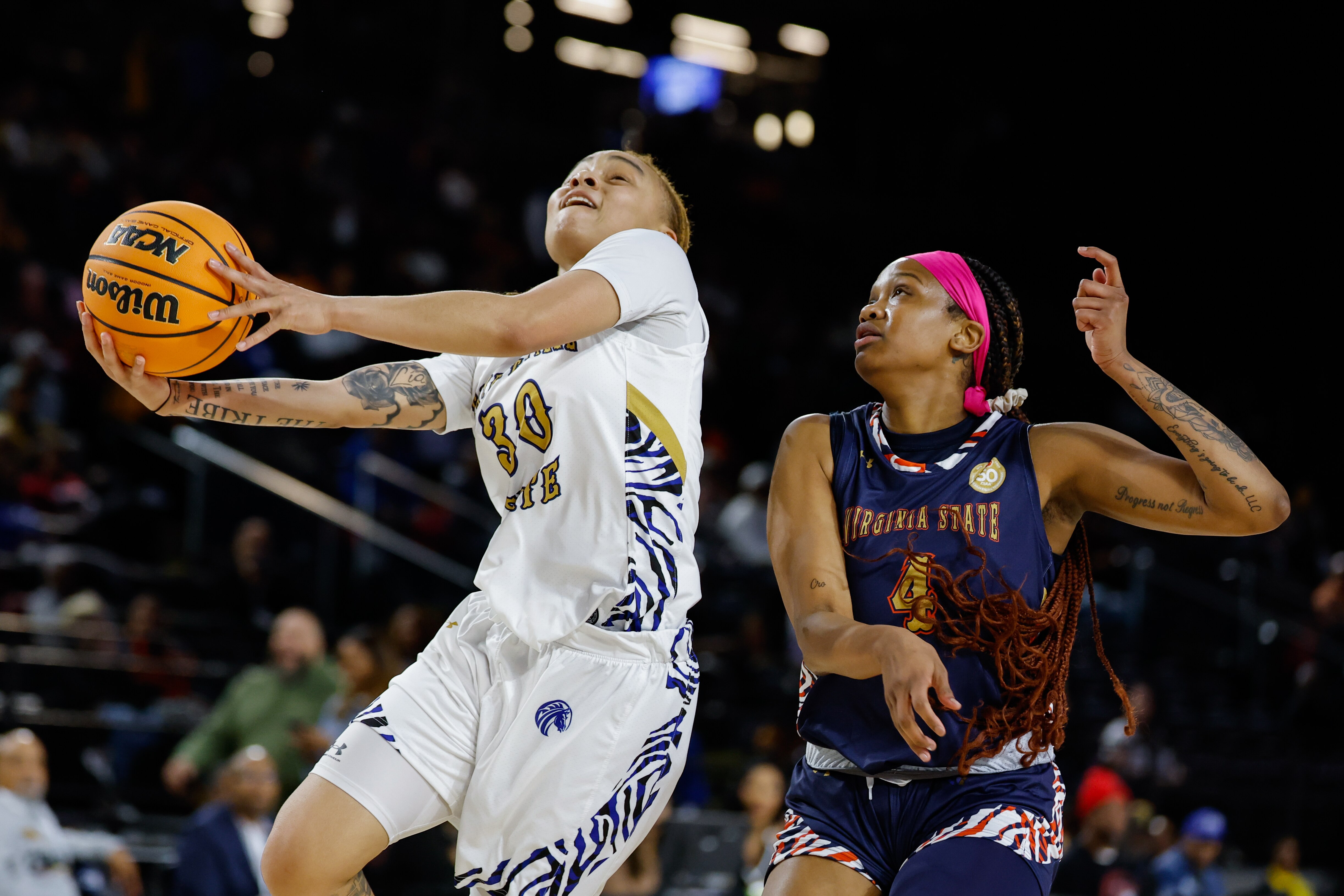 Fayetteville State forward Talia Trotter (30) goes to the basket and attempts a lay up against Virginia State forward Tanayja London (4) during the first half of the CIAA women’s final college basketball game, Saturday, Mar. 1, 2025, in Baltimore, Md.