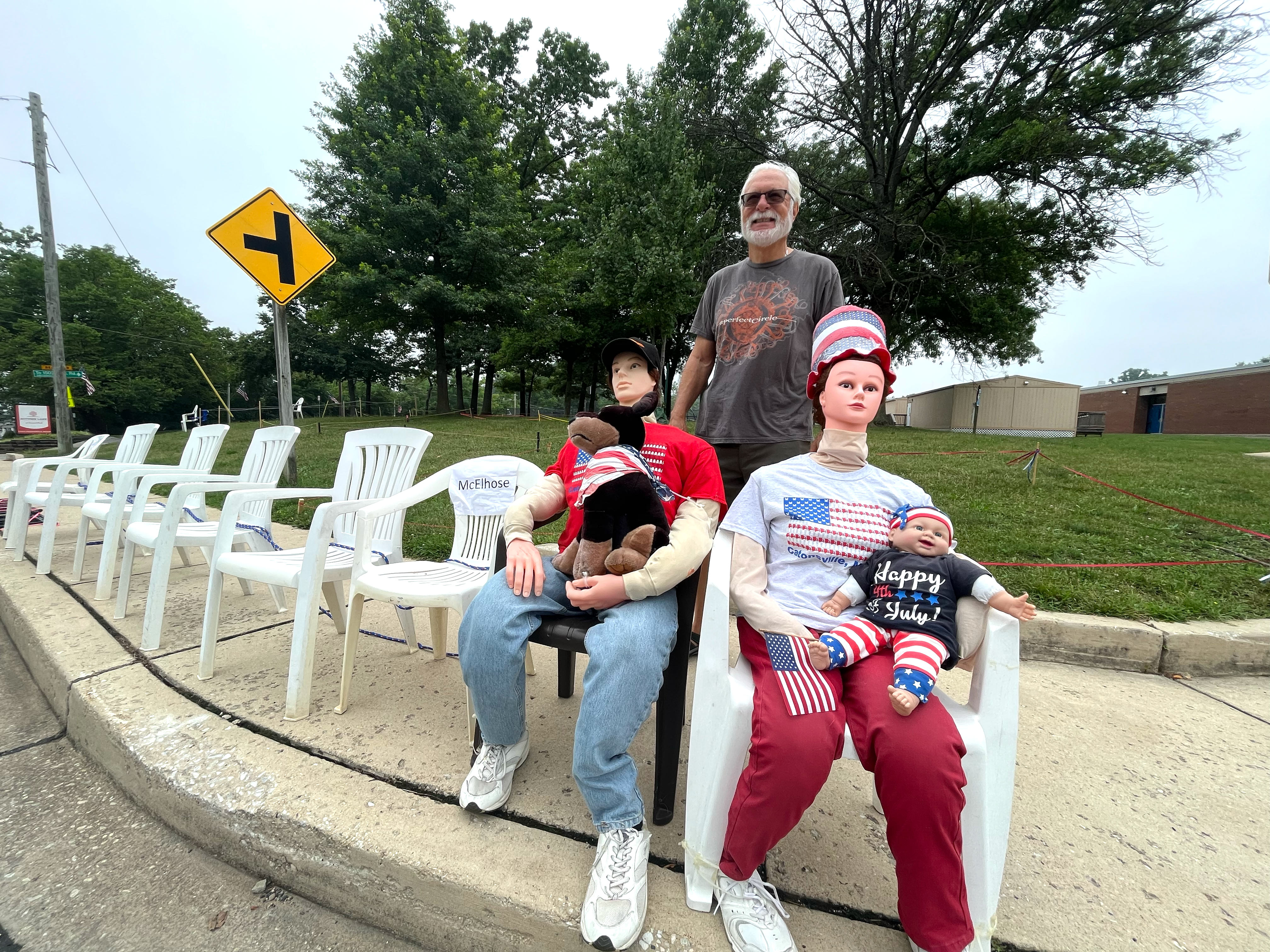 Ed Fitzpatrick stands with mannequins that he and his wife, Holly Fitzpatrick, set out each Independence Day to reserve space on the Frederick Road parade route and to show their holiday spirit.