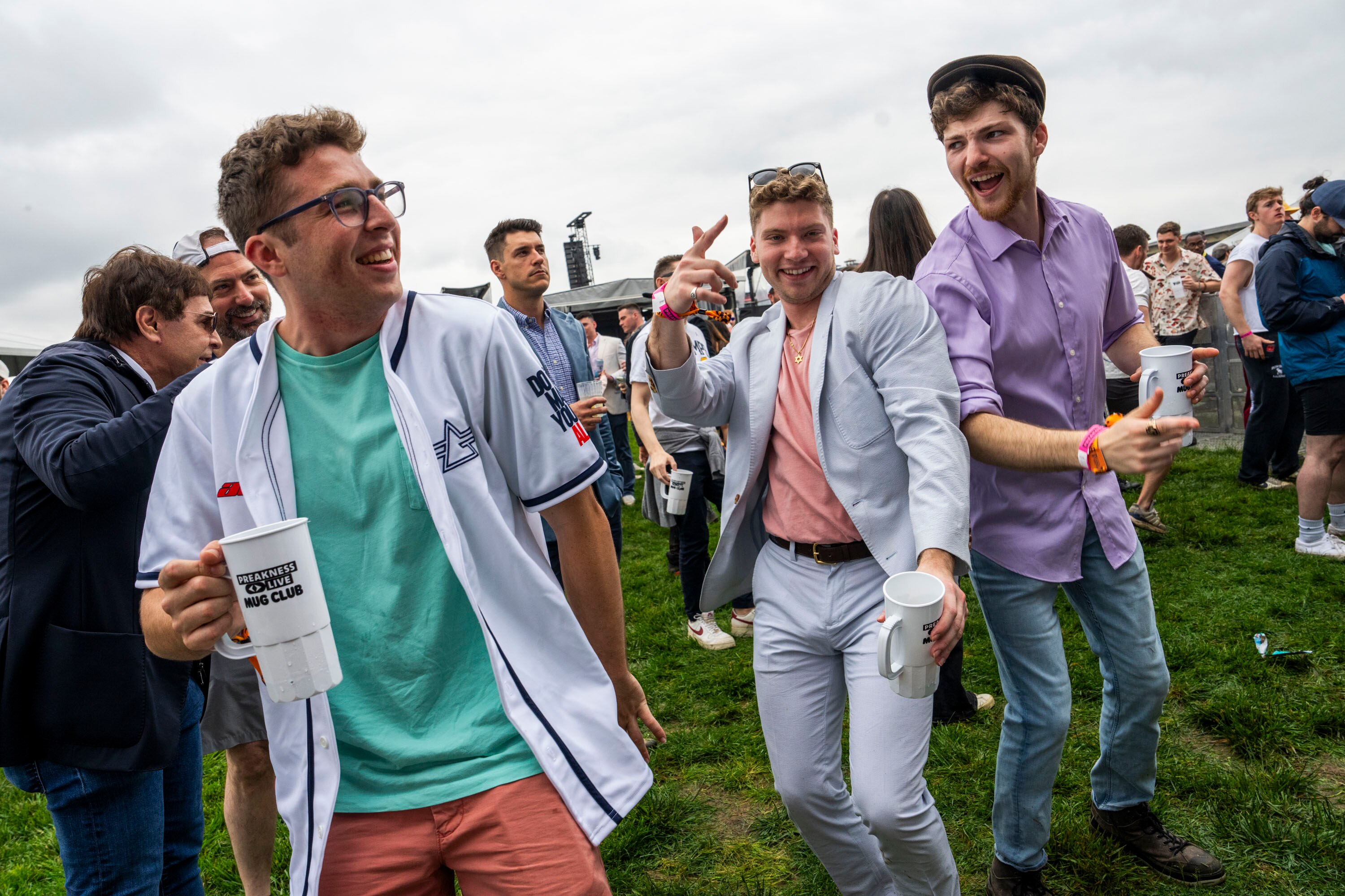 Concert attendees dance at InfieldFest during the Preakness Stakes at Pimlico Race Course in 2024.