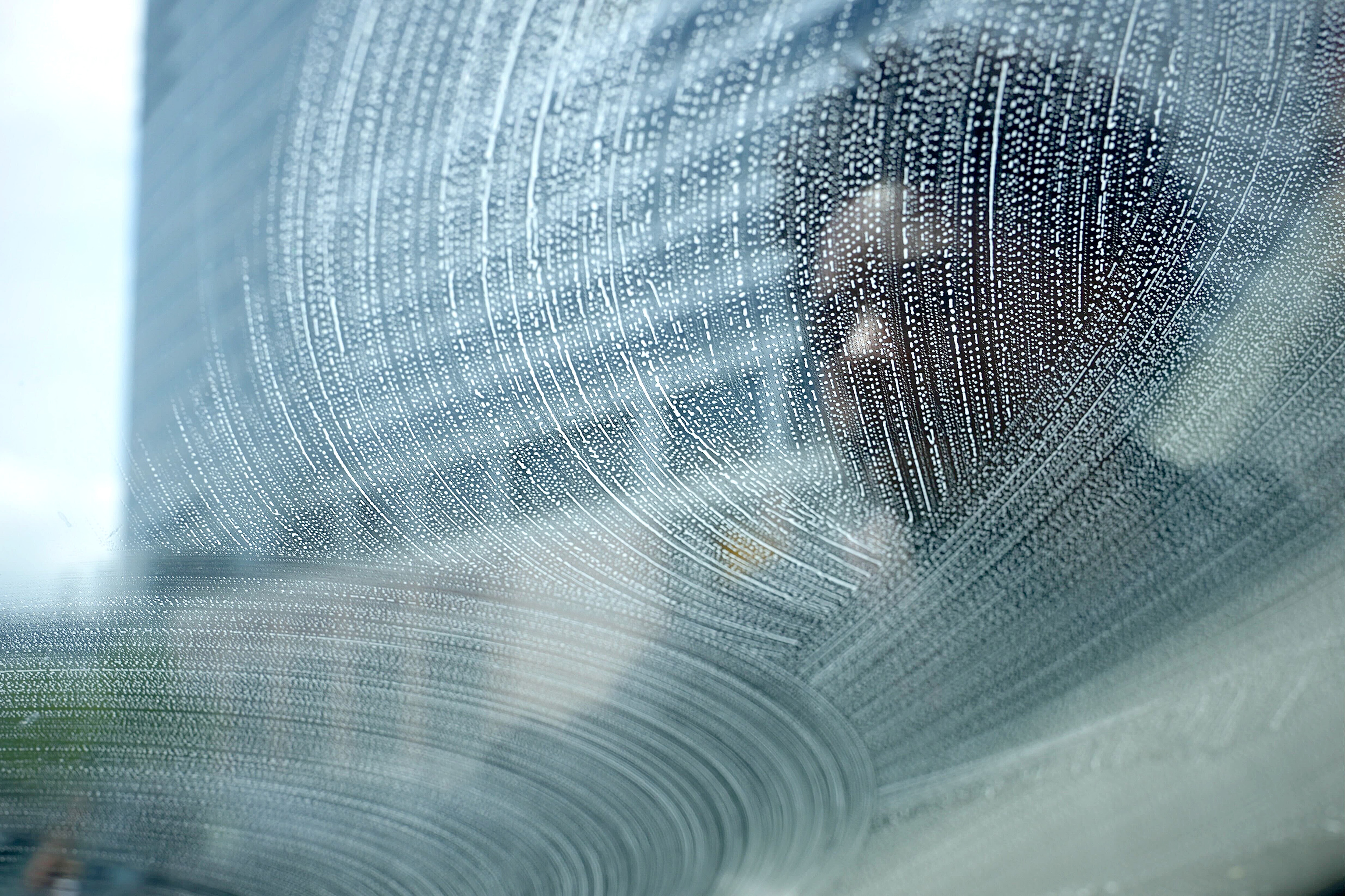 City officials estimate that more than 200 young people regularly work at intersections citywide, dashing into the street as traffic lights turn red to clean windshields in exchange for cash from drivers.