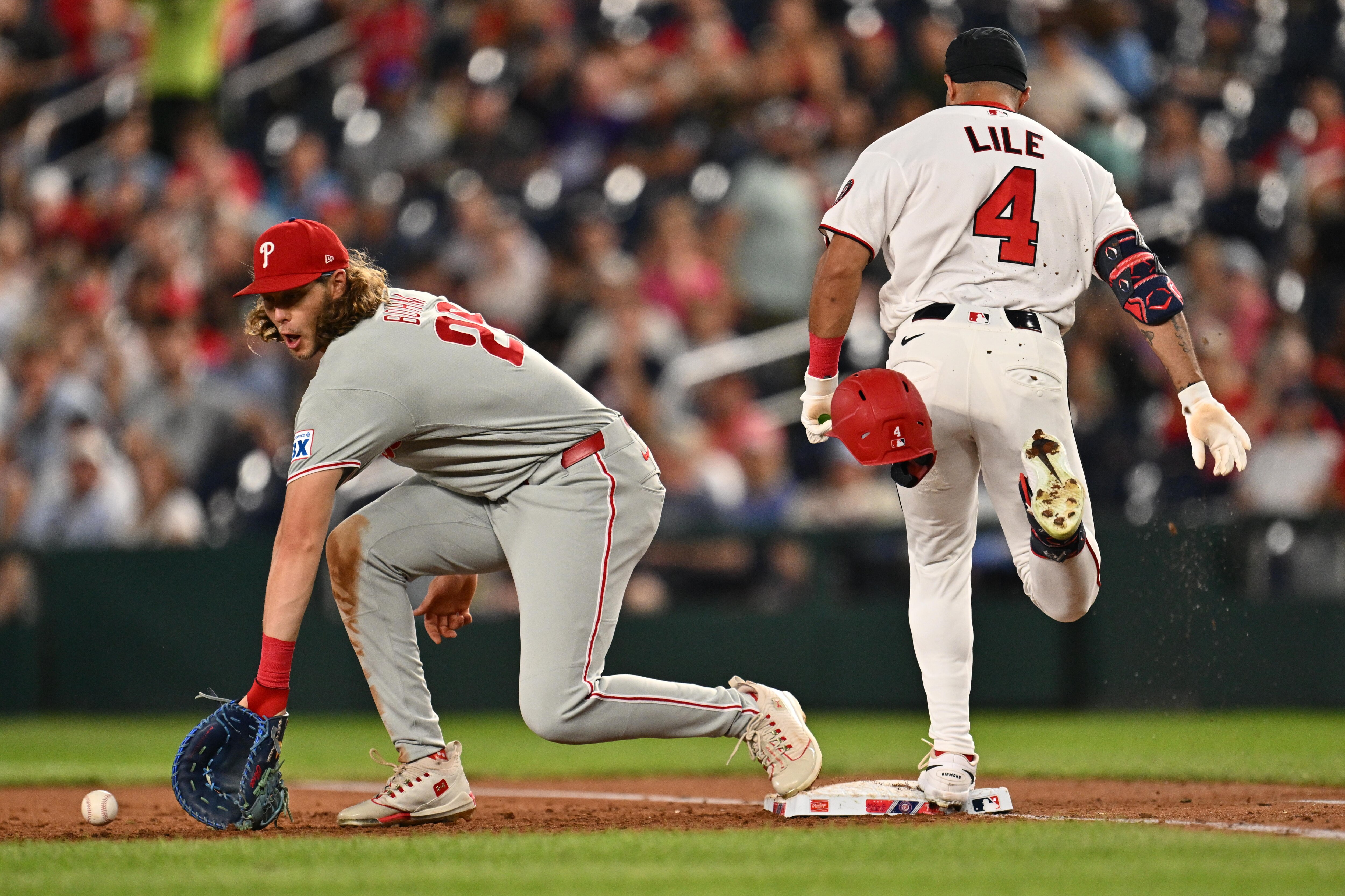 Daylen Lile beats the throw for an infield hit Wednesday night during the third inning of the Nationals’ 3-0 loss to the Phillies.