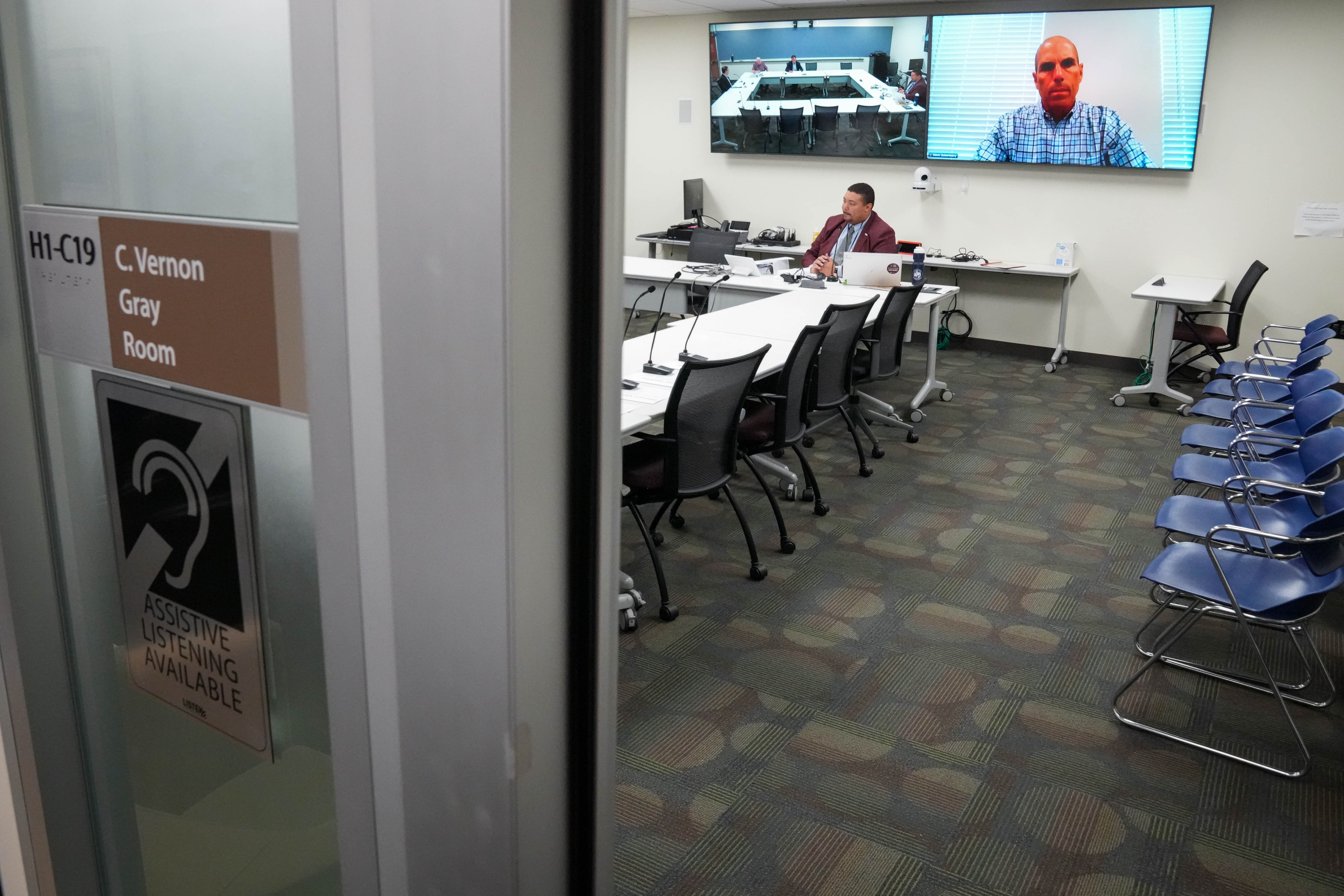 Board member Steven Quisenberry, on screen, virtually attends a meeting of the Howard County Inspector General Advisory Board, chaired by David Salem, center left, in Ellicott City on Thursday.