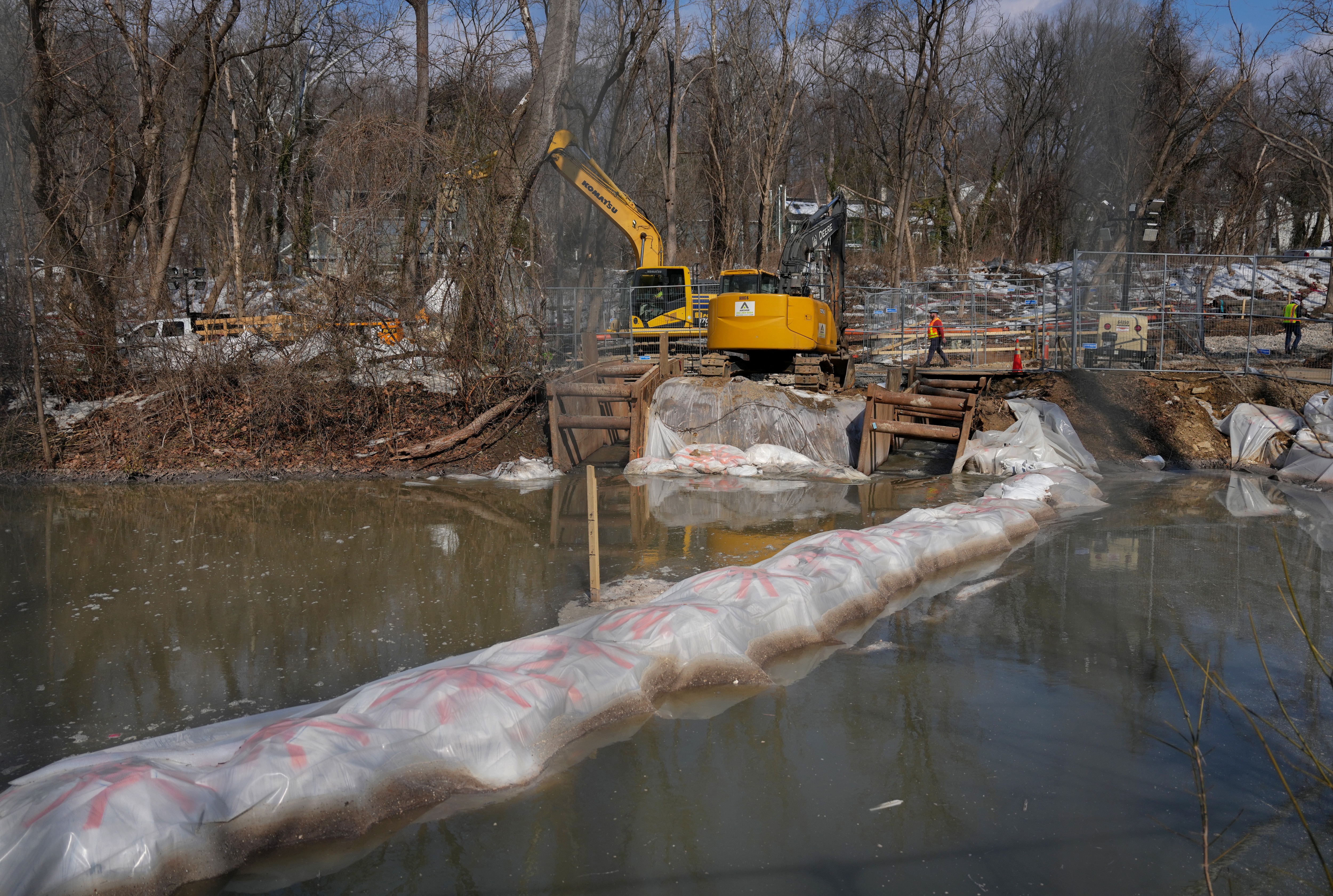 Work continues on the collapsed Potomac Interceptor sewer line as the rerouted sewage flows down the C&O Canal in February. 