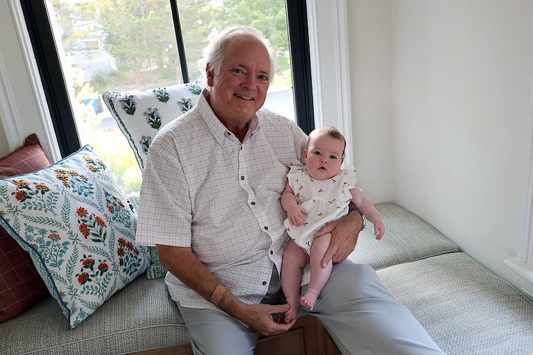 Jeff Wright and his first grandchild, Emma, at his family's beach house in Bethany Beach in summer 2025.