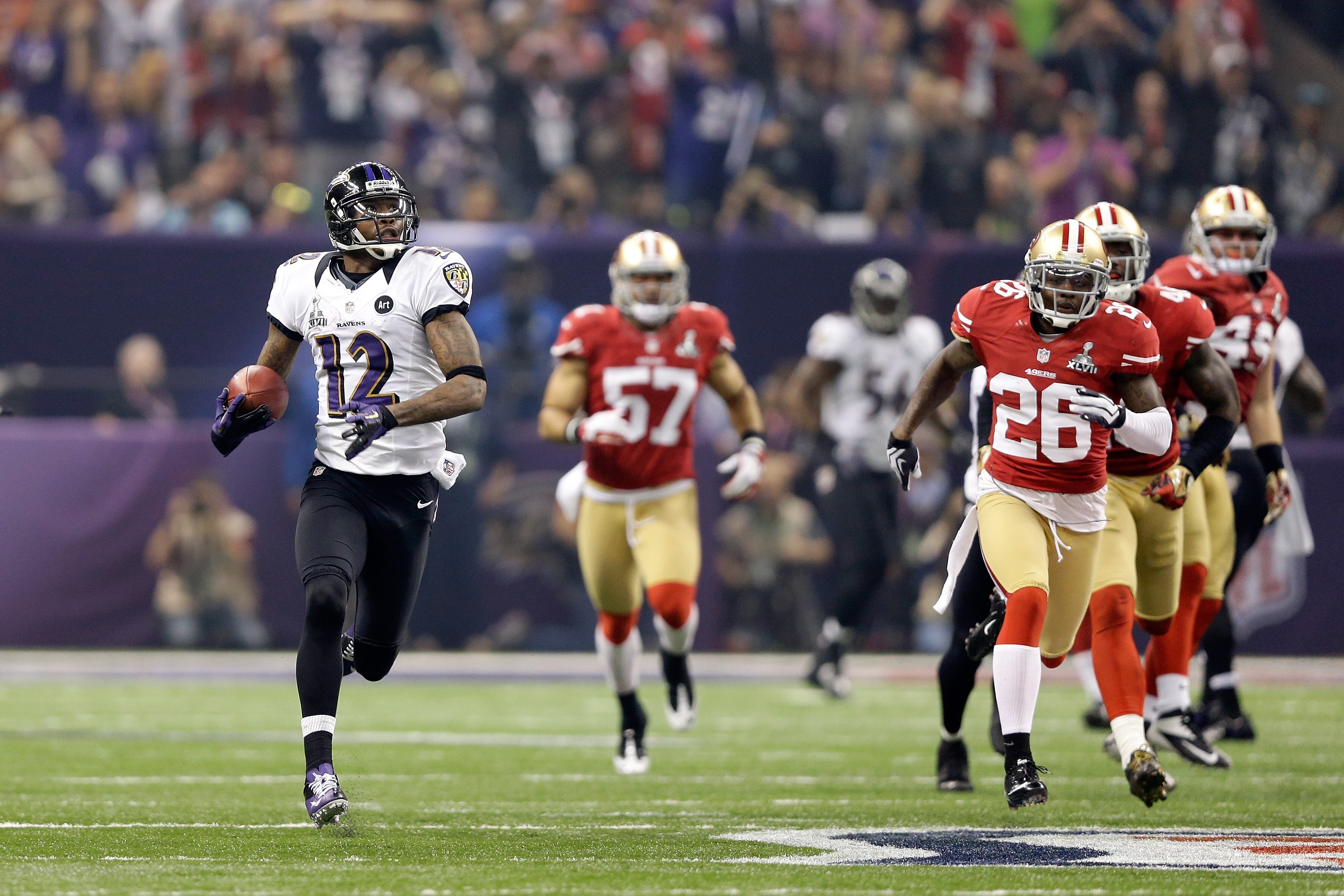 Jacoby Jones returns the opening kickoff of the second half 108 yards as the Ravens beat the San Francisco 49ers 34-31 in Super Bowl XLVII. Jones, 40, died at home Sunday.