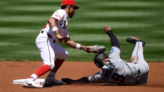 Miami Marlins' Xavier Edwards, right, is out attempting to steal second against Washington Nationals second baseman Nasim Nunez, left, during the second inning of a baseball game, Wednesday, June 3, 2026, in Washington. (AP Photo/Nick Wass)