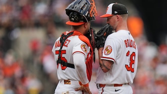 Baltimore Orioles catcher Carlos Narváez, left, talks with starting pitcher Kyle Bradish, right, during a mound visit in the second inning of a baseball game against the Boston Red Sox, Sunday, Sept. 6, 2026, in Baltimore. (AP Photo/Stephanie Scarbrough)
