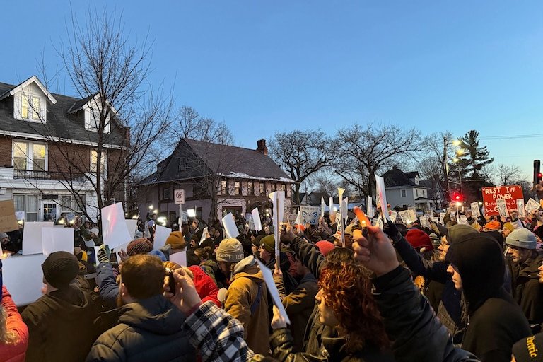 Demonstrators gather during a vigil near where an Immigration and Customs Enforcement officer shot and killed a woman in Minneapolis, Wednesday, Jan. 7, 2026.
