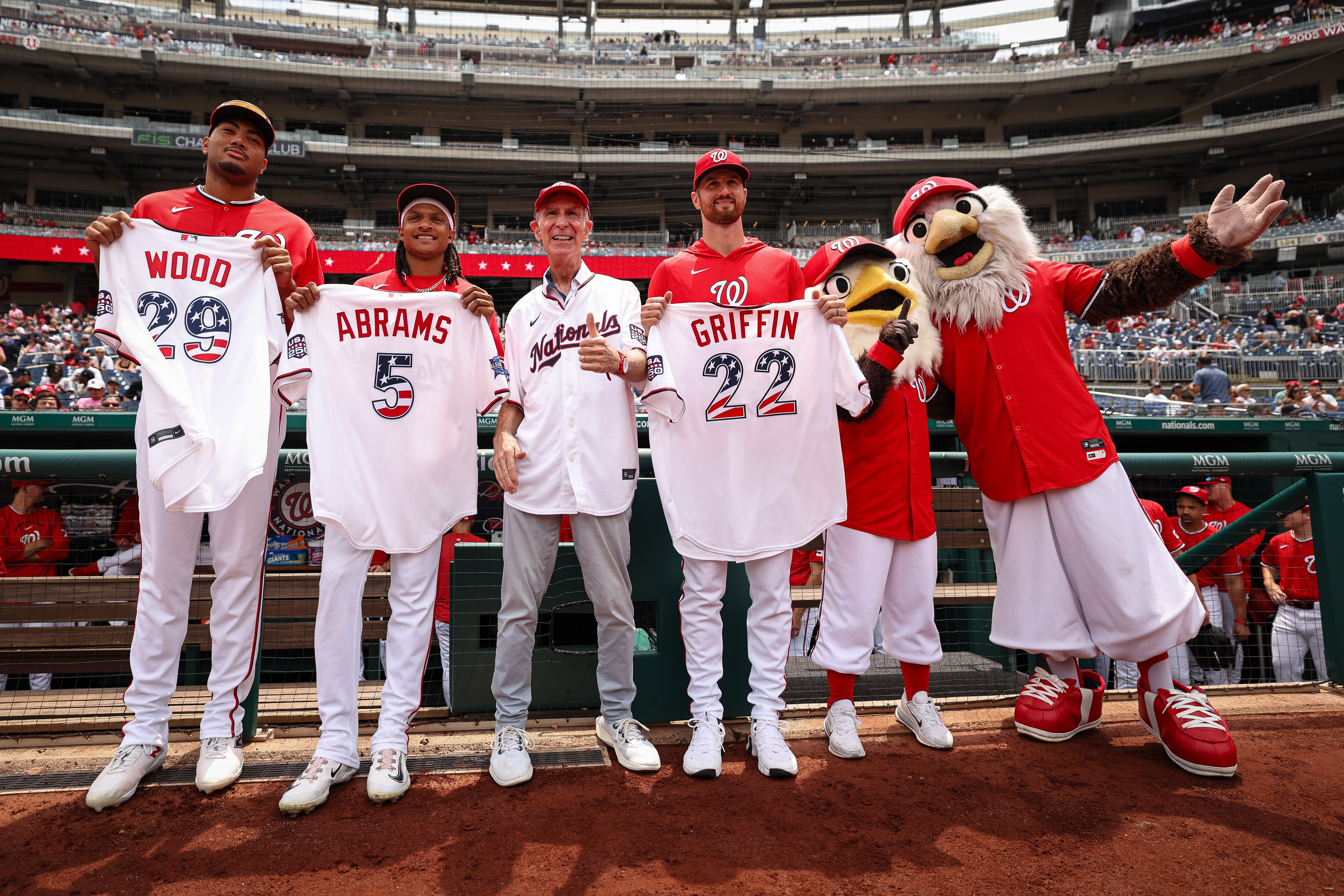 James Wood, CJ Abrams and Foster Griffin of the Washington Nationals are presented with All-Star Game jerseys by television personality Bill Nye before Sunday’s game against the New York Yankees at Nationals Park.