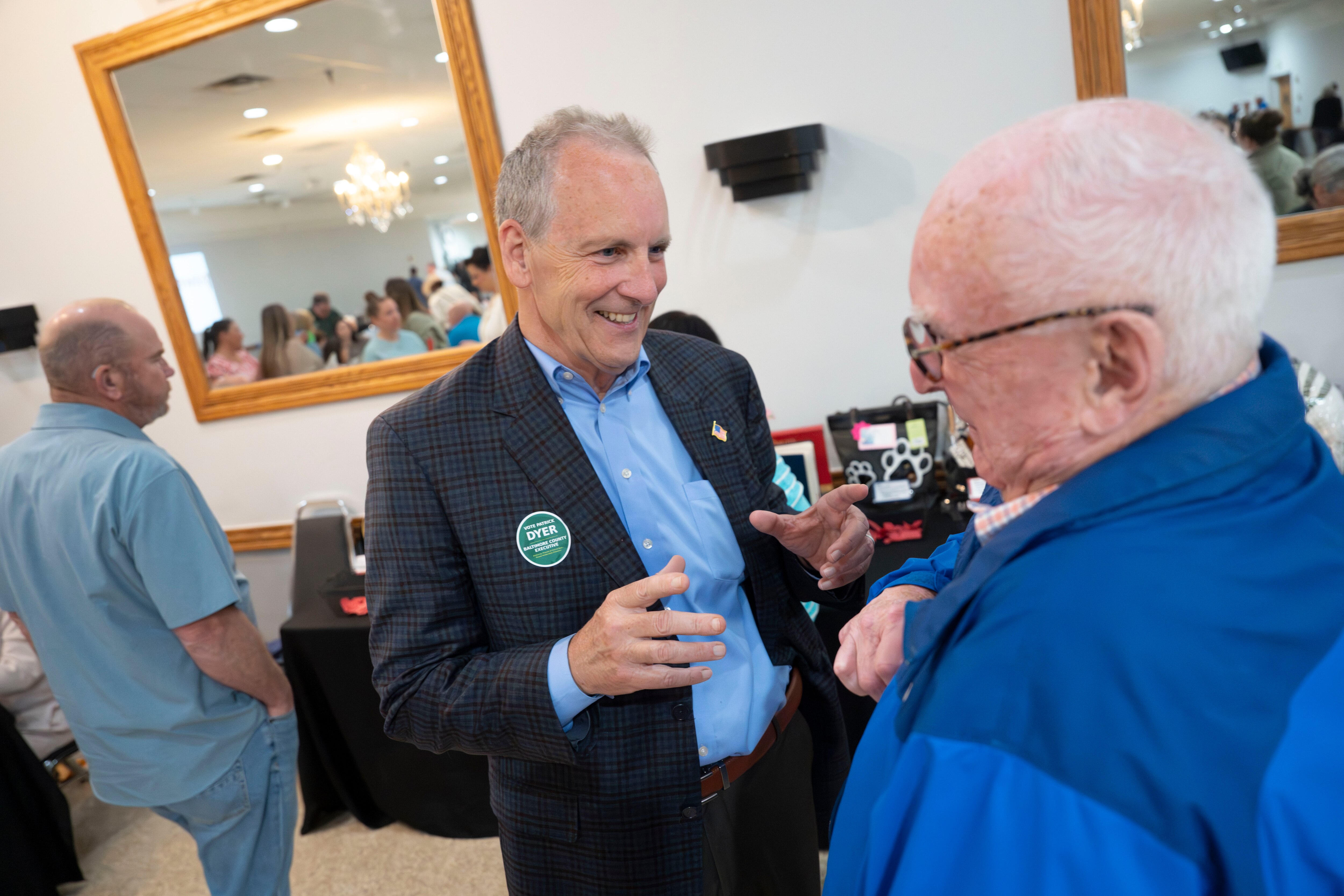 Republican candidate for Baltimore County Executive Pat Dyer attends a fundraiser for Paws4Vets Foundation. He has a conversation with supporter Mickey Ford.