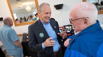 Republican candidate for Baltimore County Executive Pat Dyer attends a fundraiser for Paws4Vets Foundation. He has a conversation with supporter Mickey Ford.