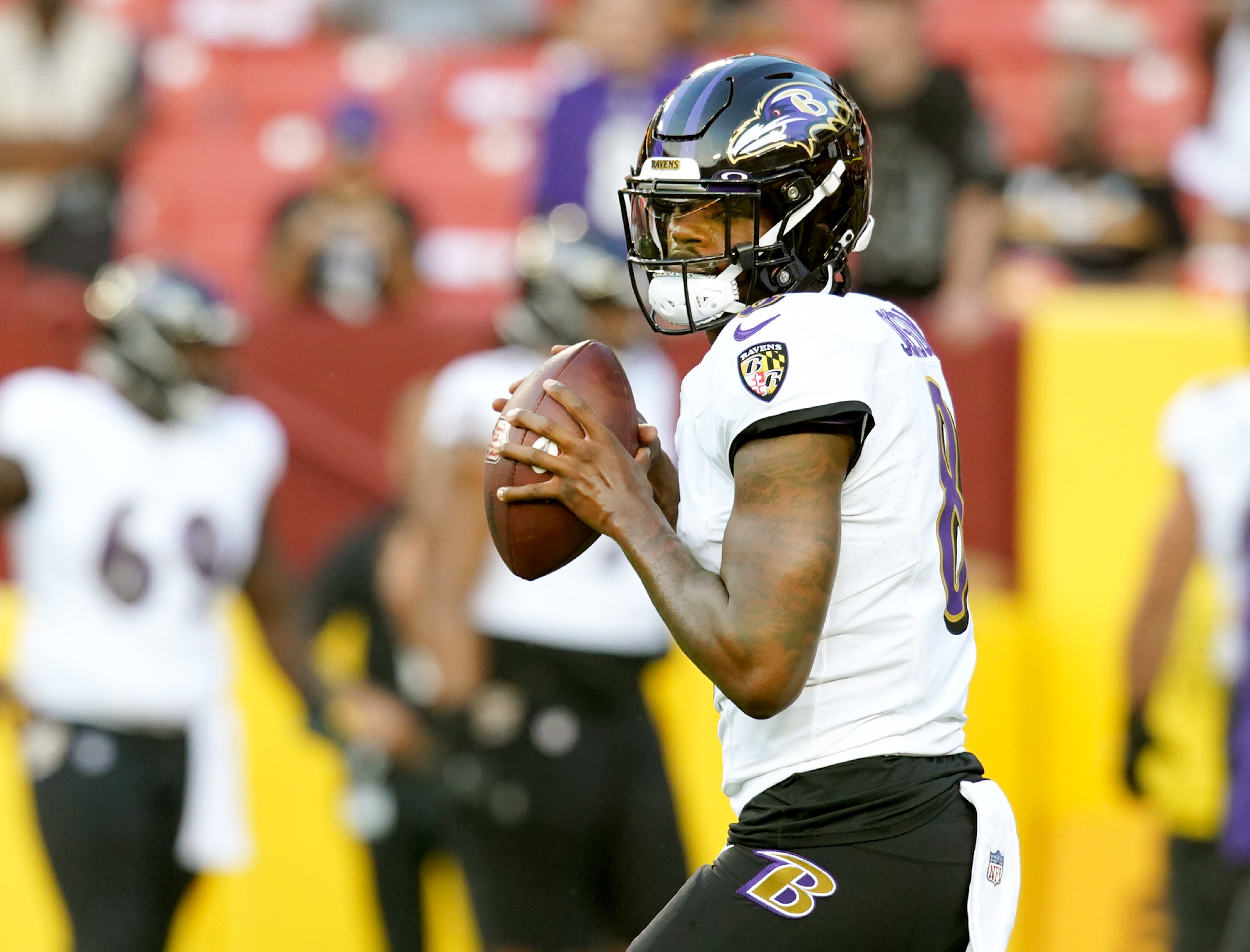 Baltimore Ravens quarterback Lamar Jackson (8) before a preseason game against the Washington Commanders at FedEx Field on Monday, August 21, 2023.