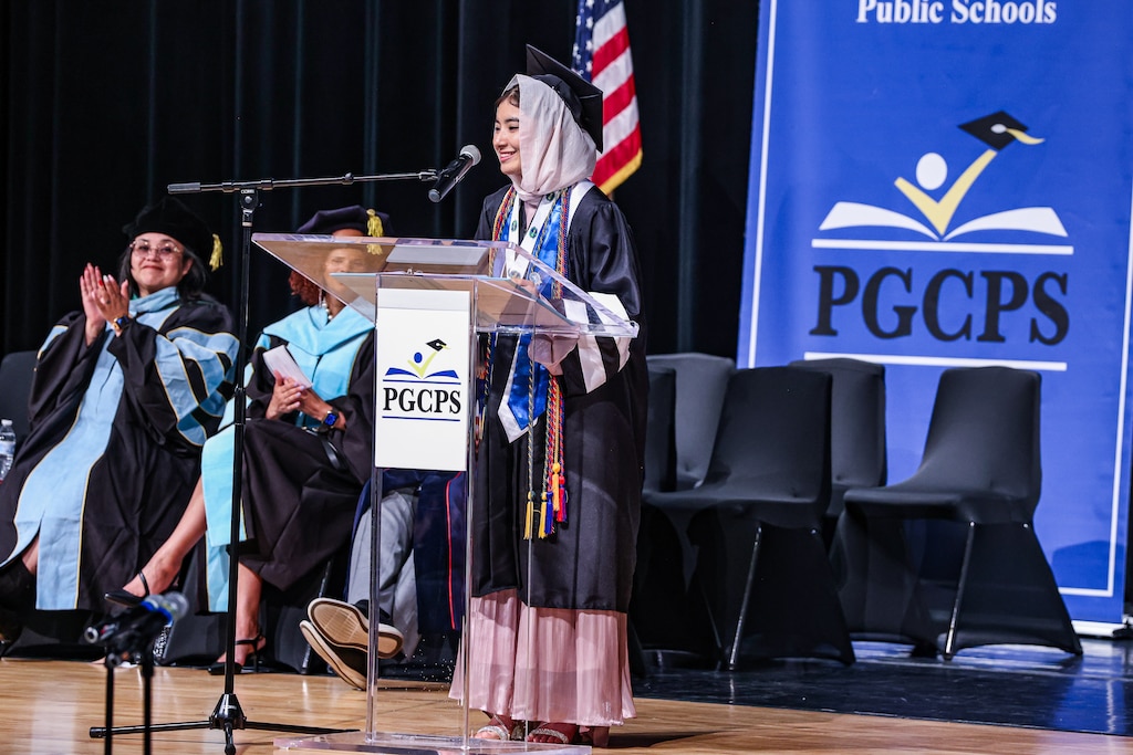 Class valedictorian Khatira Rustami, who came to the United States from Afghanistan at age 10 without speaking English, delivers her speech during her graduation from International High School at Largo in Upper Marlboro, Md.