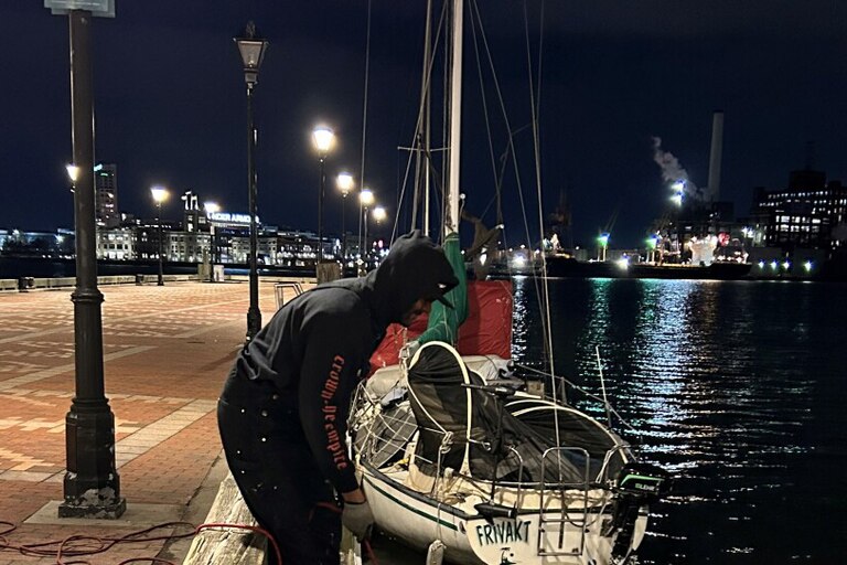 Evan Woodard magnet fishes off a pier in the Fells Point neighborhood of Baltimore on Jan. 26.