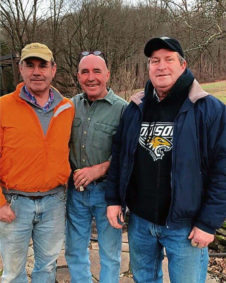 Kevin Kellar with his best friends from high school, Josh Pons, left, and Jeff Jones, right, in 2023.