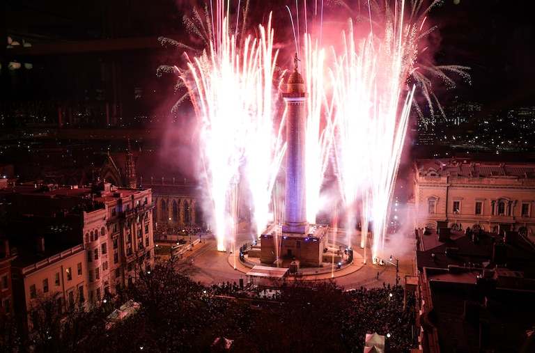 Fireworks light up the sky around the Washington Monument during the 52nd Monument Lighting at Mount Vernon Place on Thursday, December 7, 2023.