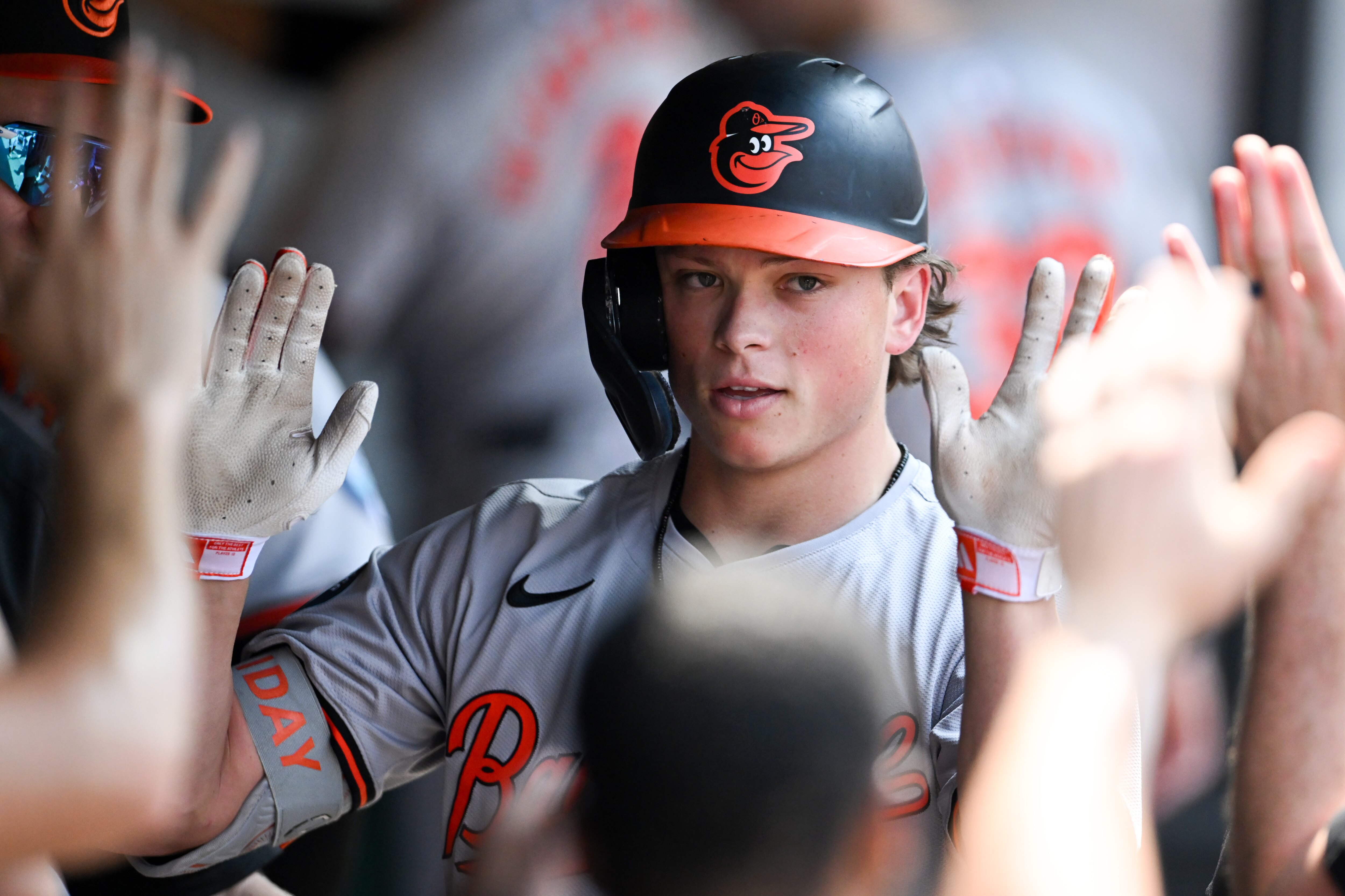Jackson Holliday gets high-fives after the second home run of his career Sunday in Cleveland.