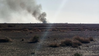 This image, taken by Sepahnews, Iranian state media, shows black smoke rising from the spot Iran claims that two United States aviators crashed during an operation over Isfahan province, Iran.