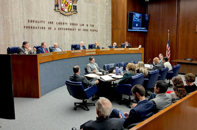 Councilmember Todd Crandell, left, speaks about the success of Tradepoint Atlantic during a Baltimore County Council meeting on Monday where they unanimously approved a 50-year tax credit for a massive port project at Sparrows Point.