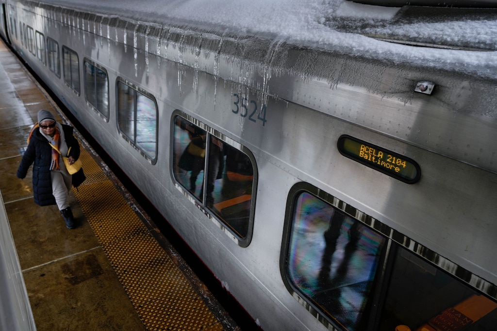 Travelers board their Amtrak trains at Penn Station in Baltimore, Md., on Monday, January 26, 2026.