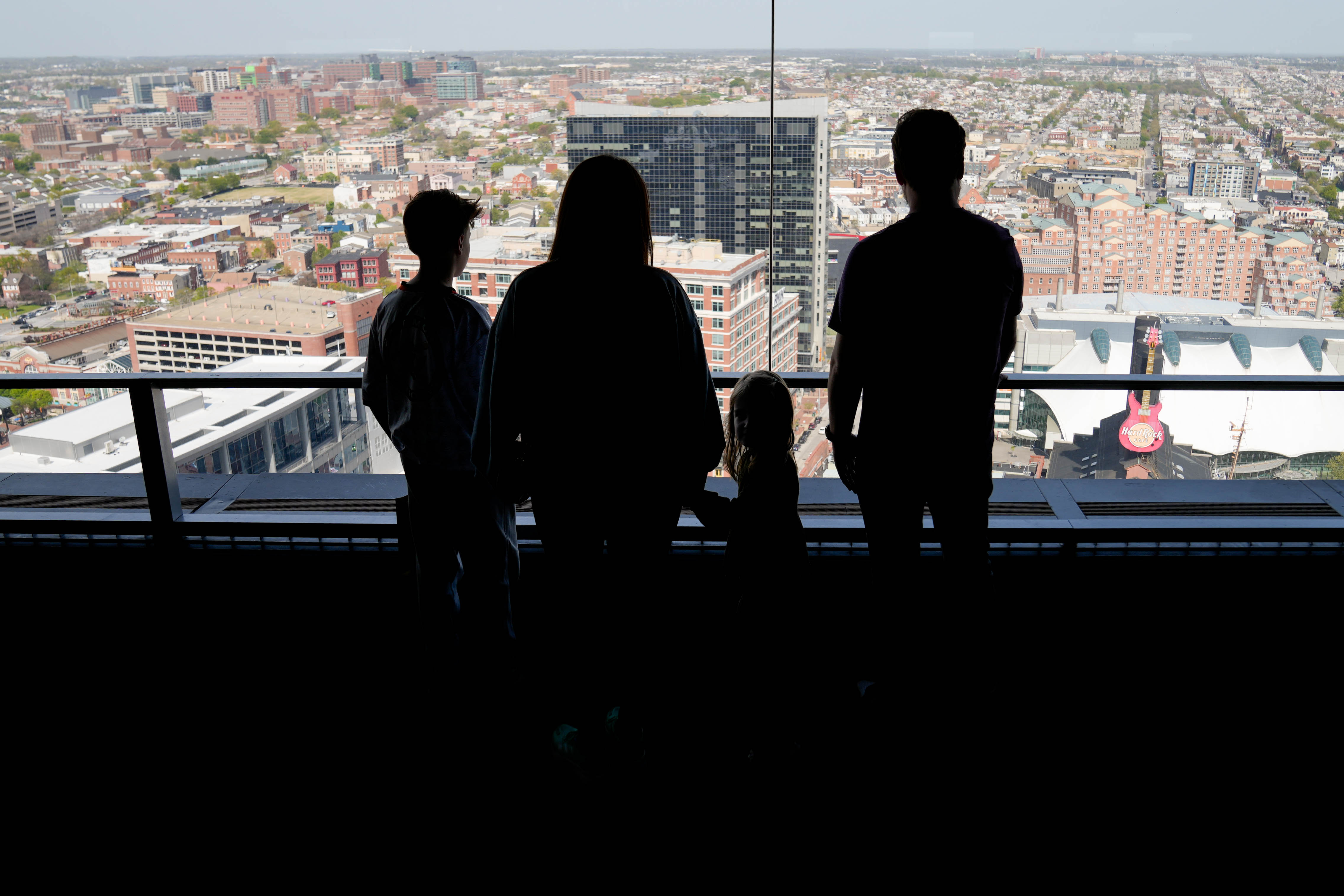 Matt Nale, right, with his wife, Amanda, and their children, Hudson and Elle, take in the view from the Baltimore World Trade Center’s Top of the World Observation Level in April.
