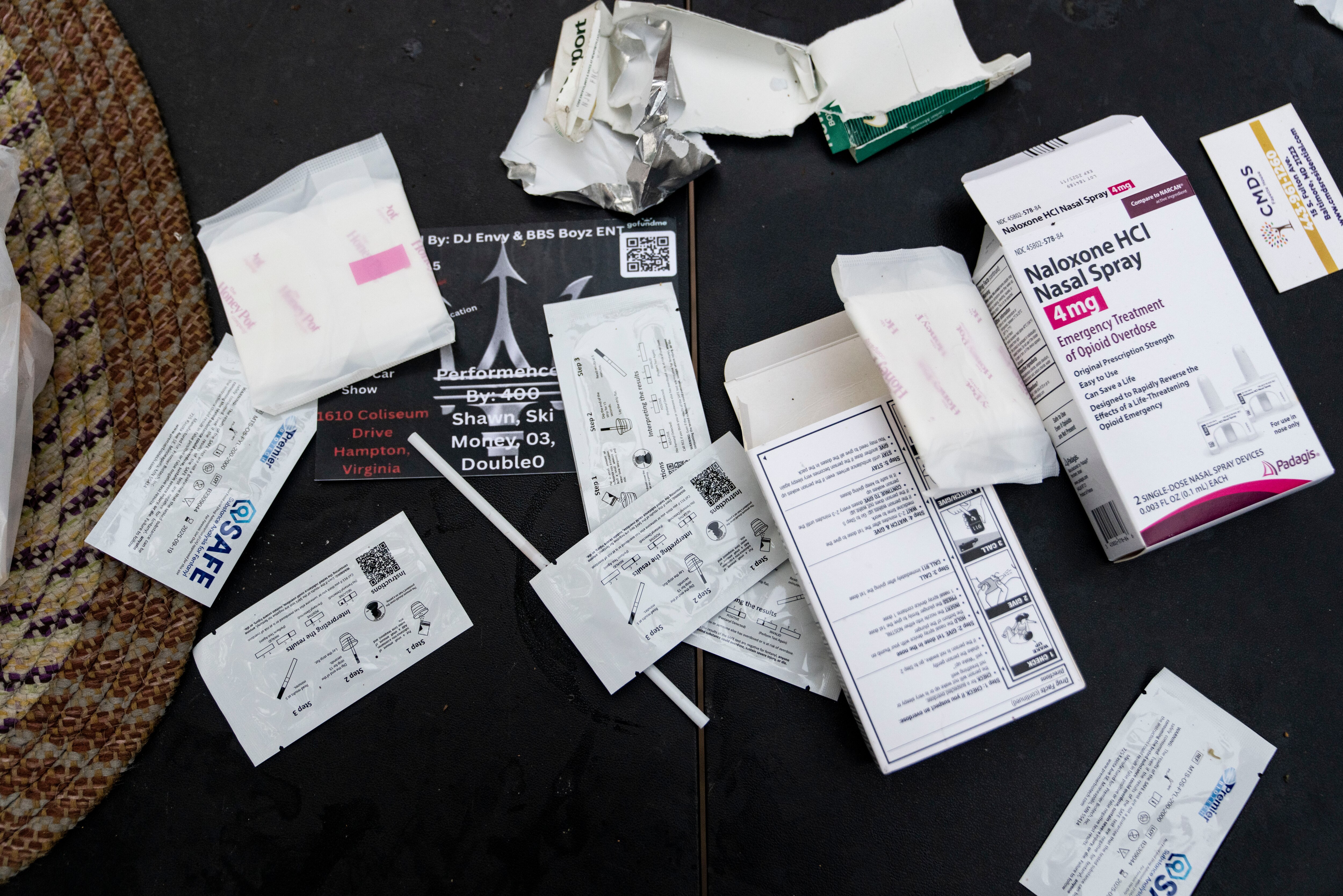 Boxes of naloxone, testing strips and other resources at North and and Pennsylvania avenues in Baltimore, days after a mass overdose in the Penn North neighborhood.