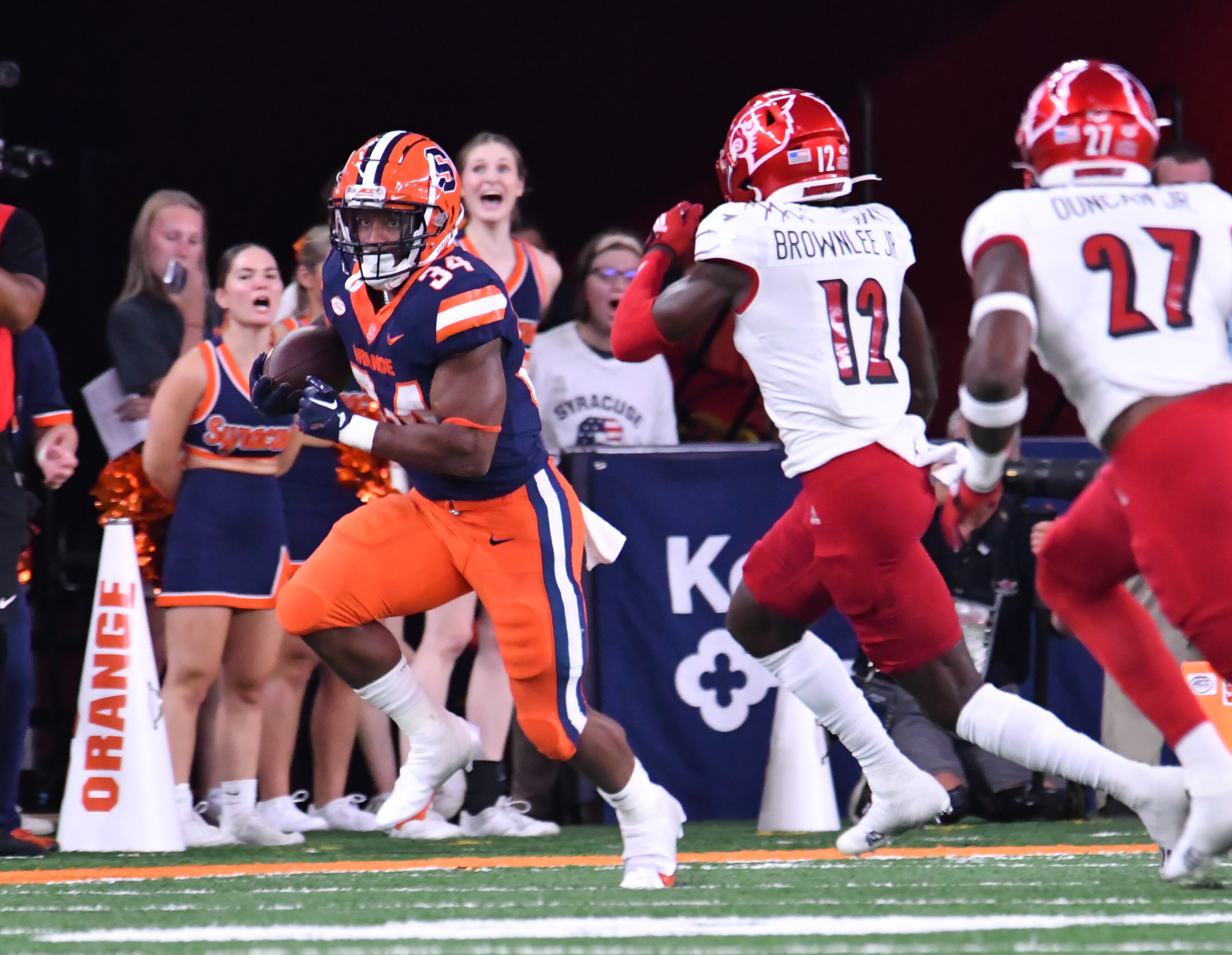 Syracuse Orange running back Sean Tucker (34) runs against Louisville Cardinals cornerback Jarvis Brownlee (12) in the first quarter at JMA Wireless Dome.