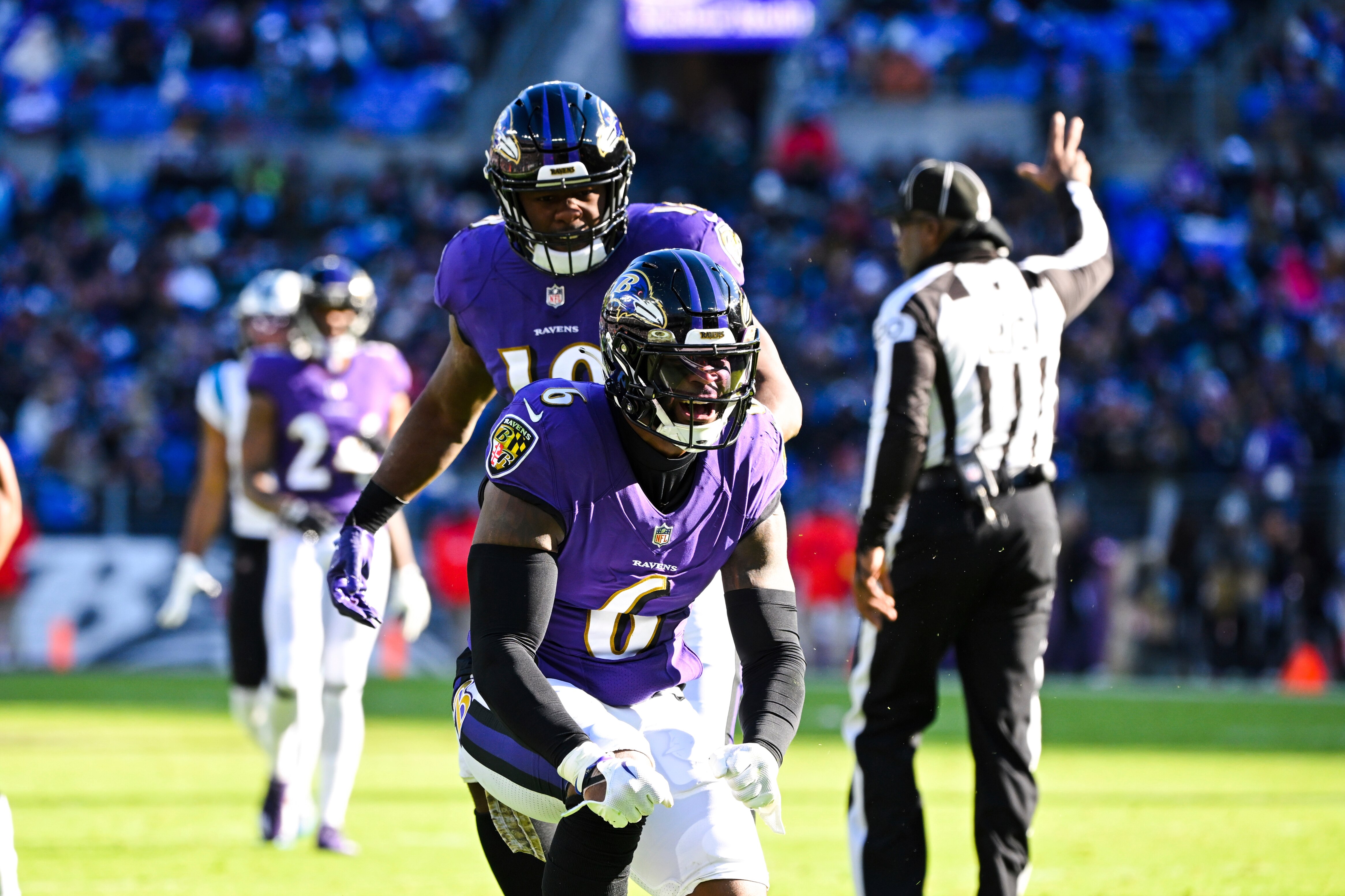 Baltimore Ravens linebacker Patrick Queen (6) celebrates a tackle with linebacker Roquan Smith during the first half of an NFL football game against the Carolina Panthers, Sunday, Nov. 20, 2022, in Baltimore.