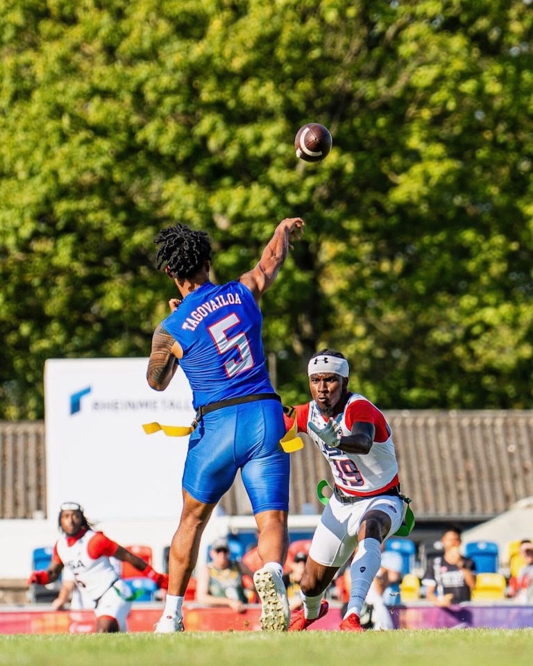 Taulia Tagovailoa throws a pass during a 38-32 upset of Team USA in the Flag Football World Championships in Dusseldorf, Germany on Aug. 14, 2026. A former Maryland quarterback, Tagovailoa threw five touchdowns to help American Samoa beat the U.S., which had not lost a game since 2012.