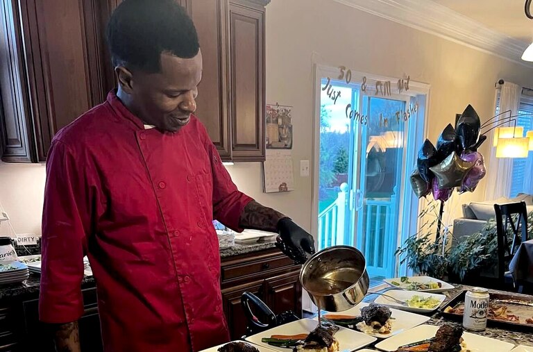 Alex Claro prepares a short rib dish.